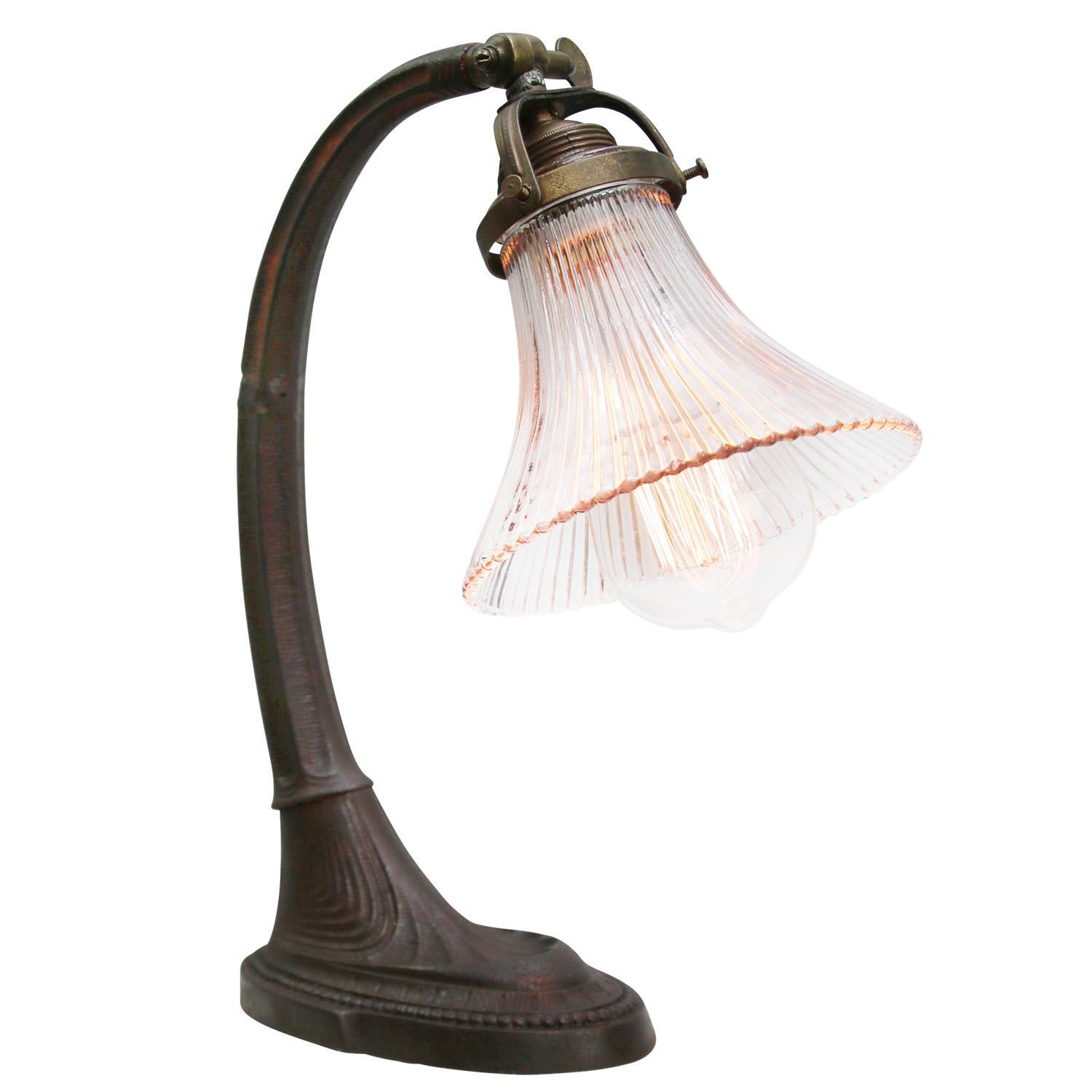 French 1920s desk light.
Cast Iron Base and arm with Holophane glass shade.
Black cotton wire and plug.

Also, available with US/UK plug

Priced per individual item. All lamps have been made suitable by international standards for incandescent