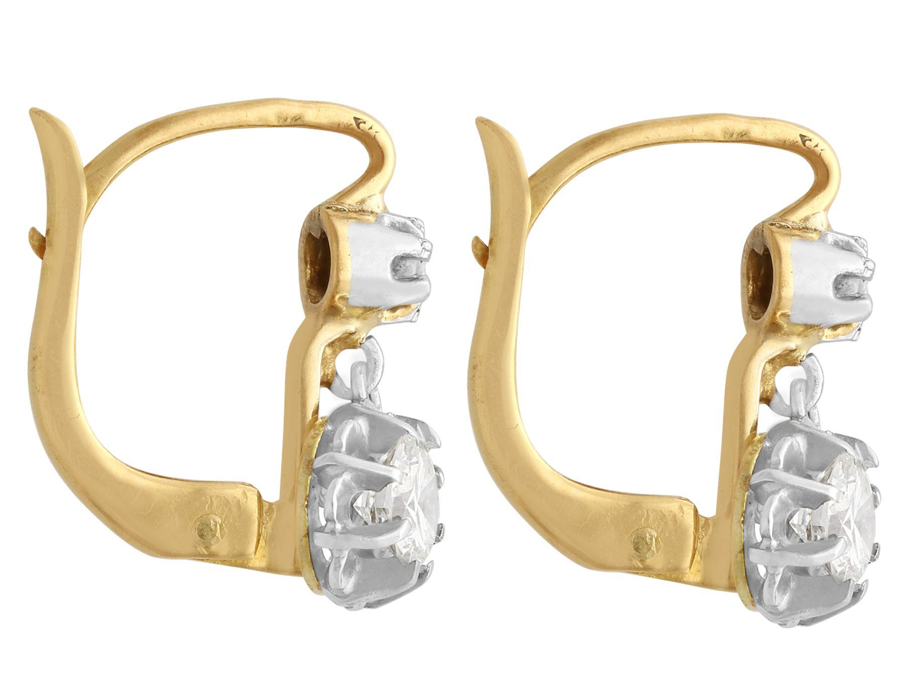A fine and impressive pair of vintage French 0.54 carat diamond and 18 karat yellow gold earrings; part of our vintage jewelry and estate jewelry collections

These fine and impressive vintage 1940s earrings have been crafted in 18k yellow