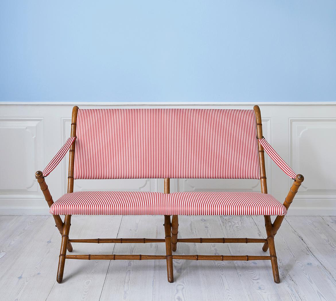 France, 1950s

Charming foldable sofa in faux bamboo with striped textile.

Size: H 84 x W 132 x D 69 cm.