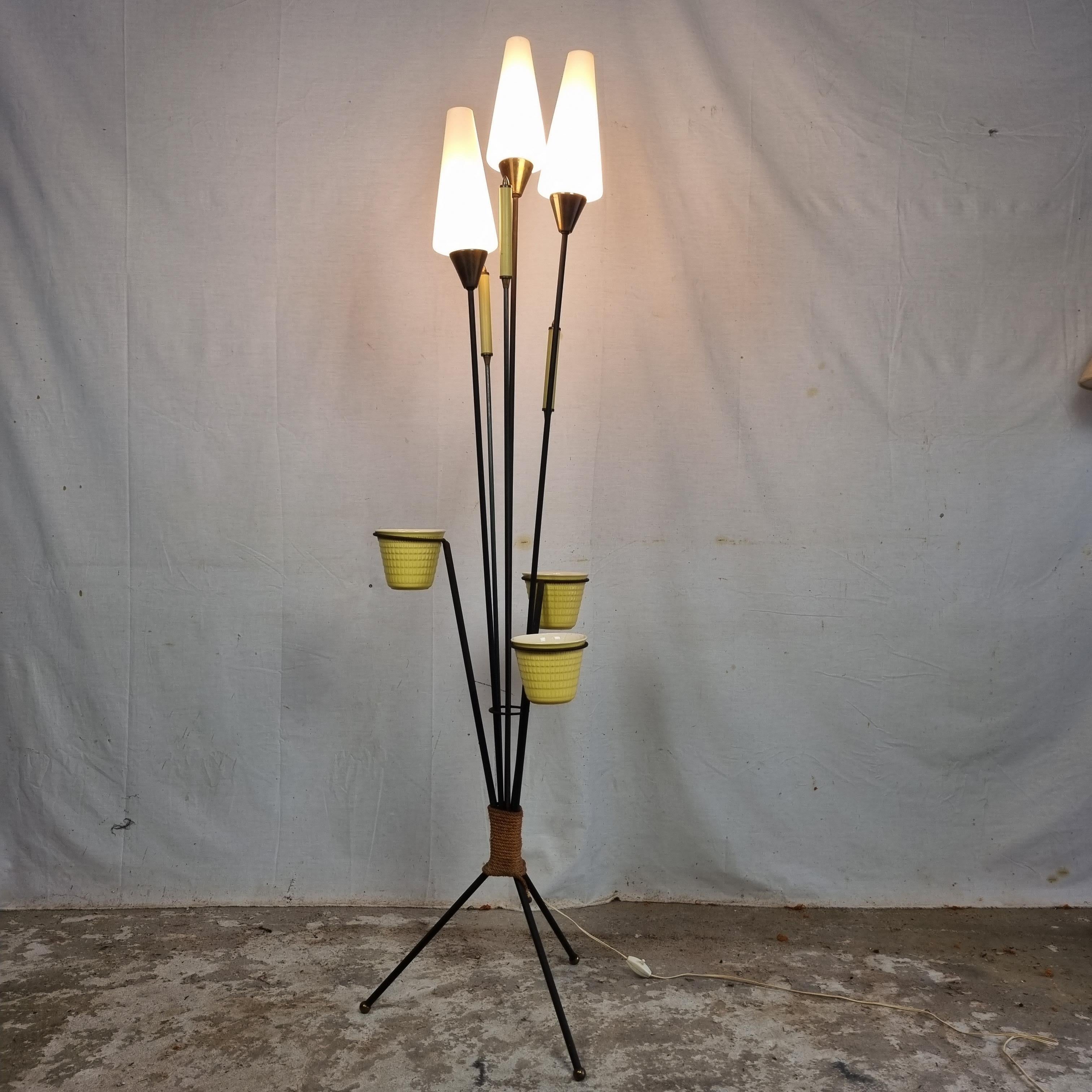 Gorgeous Rare French 🇫🇷 Vintage three legged Floor Lamp with Plant Holder from the 1950s on Metal Legs (Tripod).

Still entirely in the original state, they are rarely seen complete, equipped with opaline shades, 3 candle-shaped details, finished