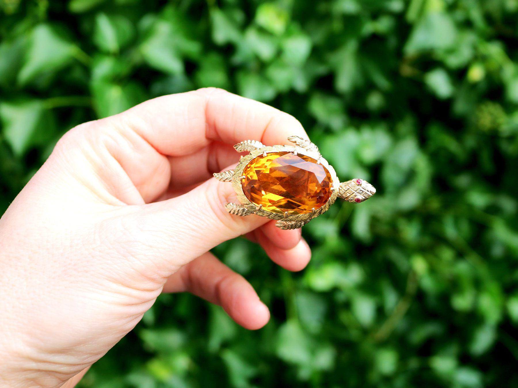 A stunning vintage French 38.65 carat citrine and ruby, 18 karat yellow gold 'turtle' brooch; part of our diverse gemstone jewelry and estate jewelry collections.

This stunning, fine and impressive vintage oval cut turtle brooch has been crafted in
