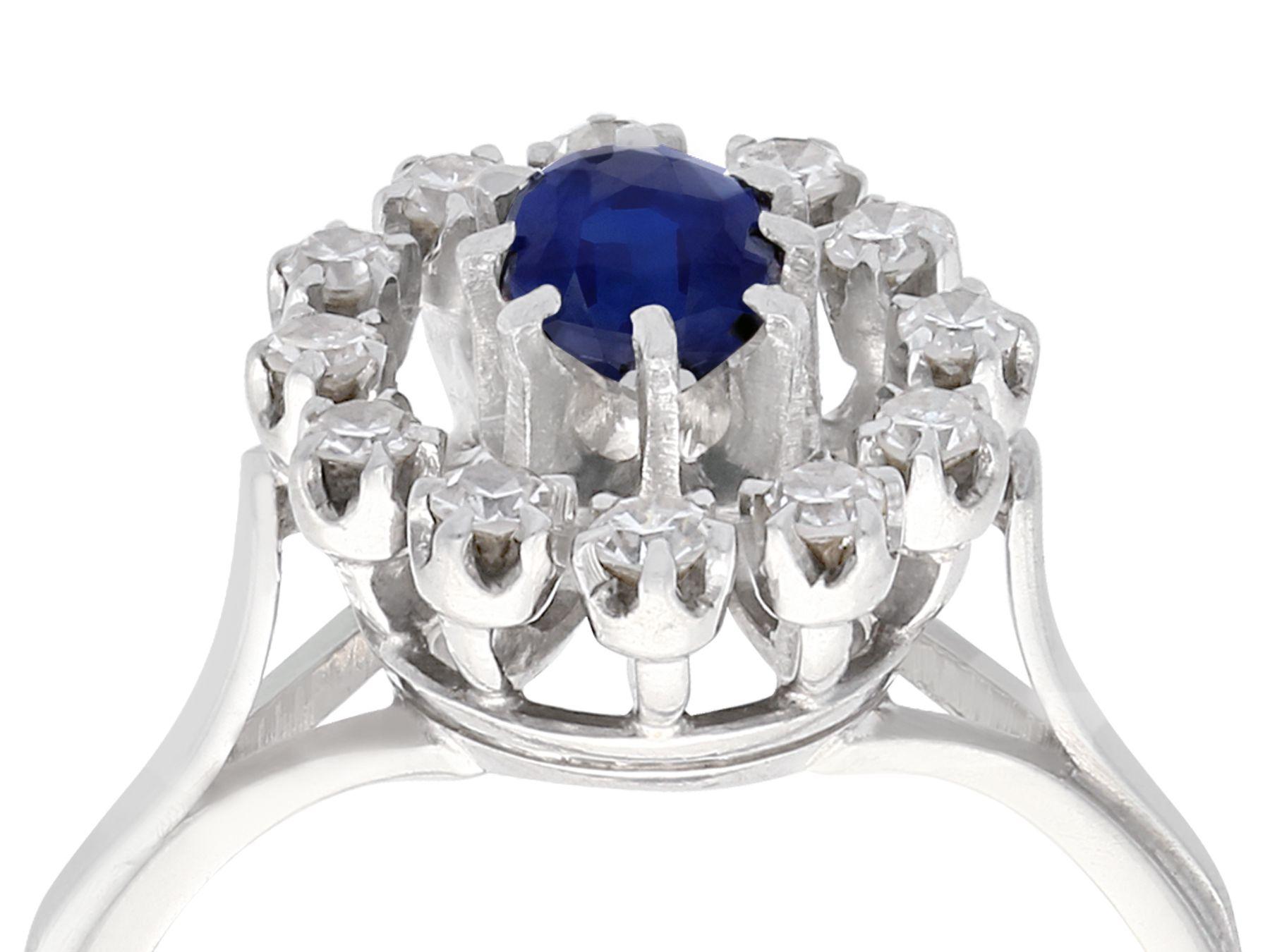 An impressive vintage French 0.60 carat sapphire and 0.42 carat diamond, 18 karat white gold cluster ring; part of our diverse antique jewelry collections.

This fine and impressive small sapphire and diamond cluster ring has been crafted in 18k