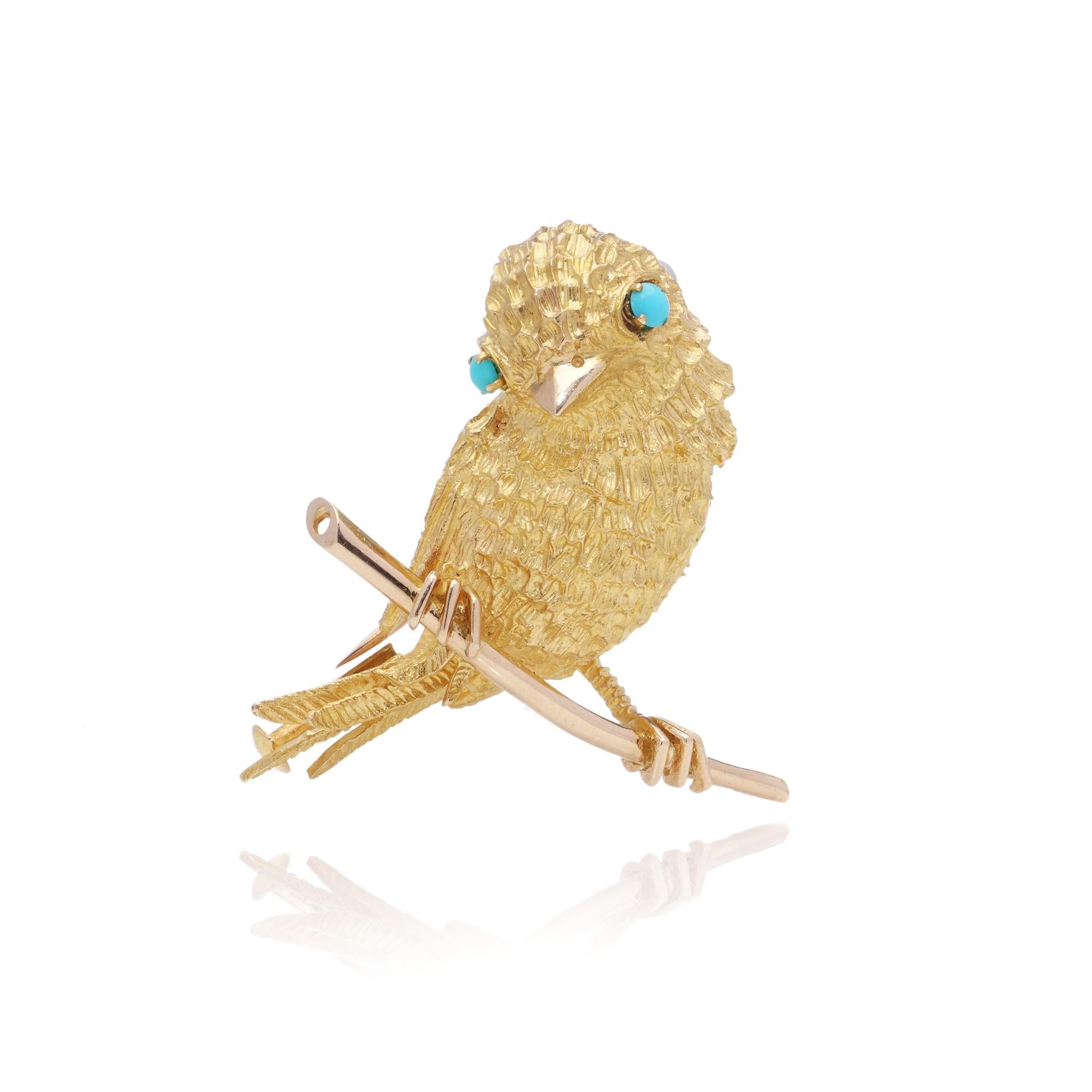 Vintage French 22kt Yellow Gold Textured Bird Brooch with Turquoise Eyes.

A charming vintage brooch crafted in 22kt yellow gold, featuring an intricately textured bird design. The brooch is accented with two cabochon turquoise stones set as the