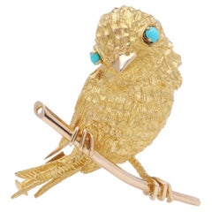 Vintage French 22kt Yellow Gold Textured Bird Brooch with Turquoise Eyes