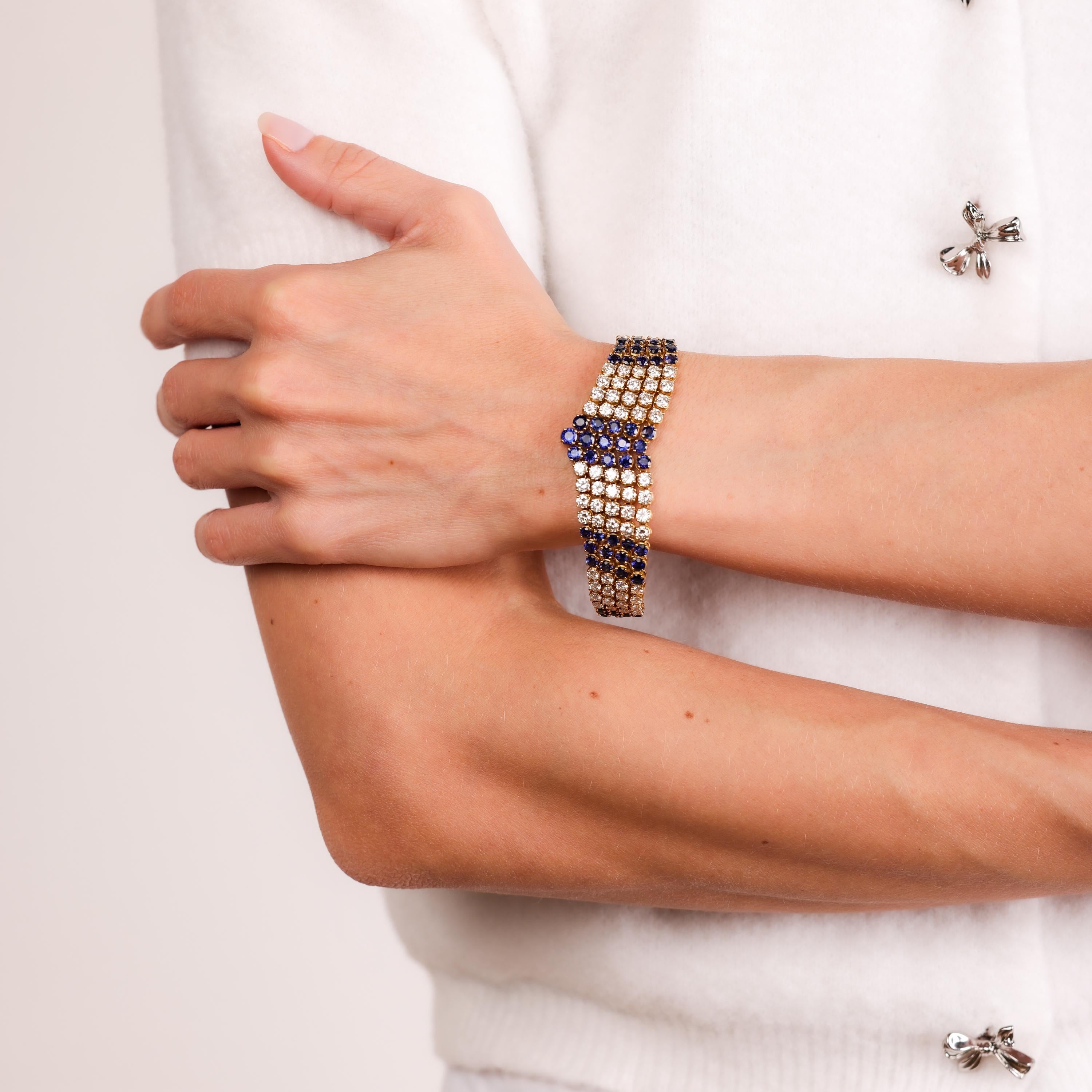 This luxurious French vintage bracelet dazzles with vibrant blue sapphires and sparkling diamonds set in elegant 18k yellow and white gold, exuding timeless charm.

Total gemstone weight: Approximately 25.10 carats
Center stone: 79 round brilliant
