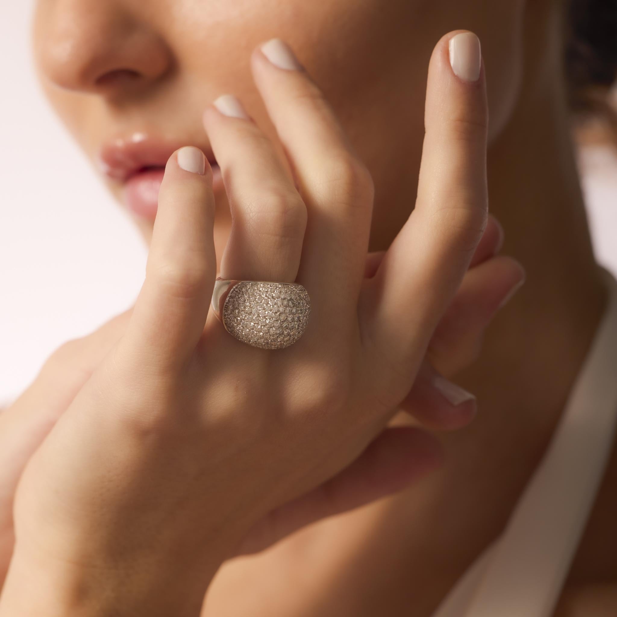 This vintage 1990s ring showcases 207 round brilliant cut diamonds totaling 3 carats, set in bold 18k white gold with French hallmarks and radiant sparkle.