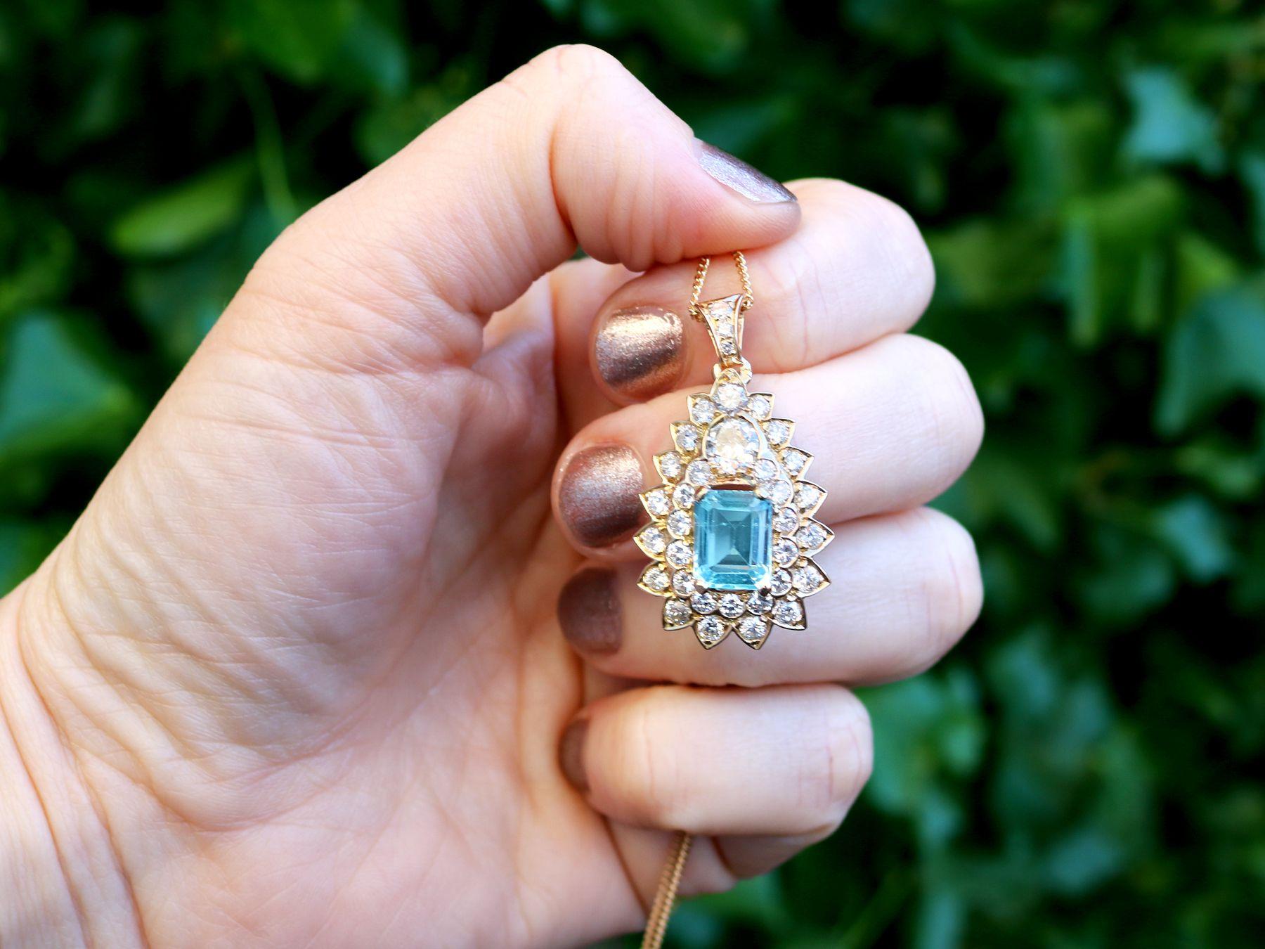 A stunning vintage French 3.95 carat topaz and 3.08 carat diamond, 18 karat yellow gold pendant and chain; part of our diverse vintage jewelry and estate jewelry collections.

This stunning, fine and impressive vintage topaz and diamond pendant has