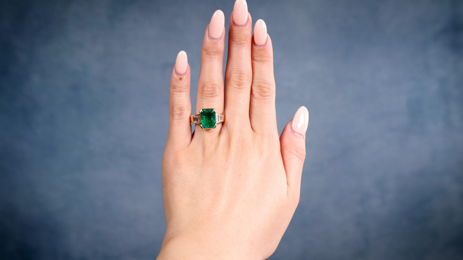 One Vintage French AGL Colombian Minor Oil Emerald 18k Yellow Gold Ring. Featuring one octagonal step cut emerald weighing approximately 3.05 carats, accompanied by AGL #1138264 stating the emerald is of Colombian origin with minor oil treatments.