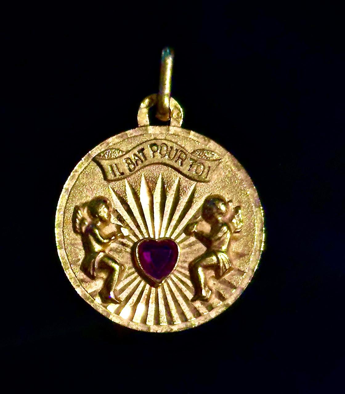 Vintage French Il Bat Pour Toi It Beats for You Pendant with Cupids and Ruby Heart Angel Pendant crafted from 18k Solid Yellow Gold Romantic Sentimental Collectible Jewelry

This vintage French pendant is a beautiful and deeply romantic piece,