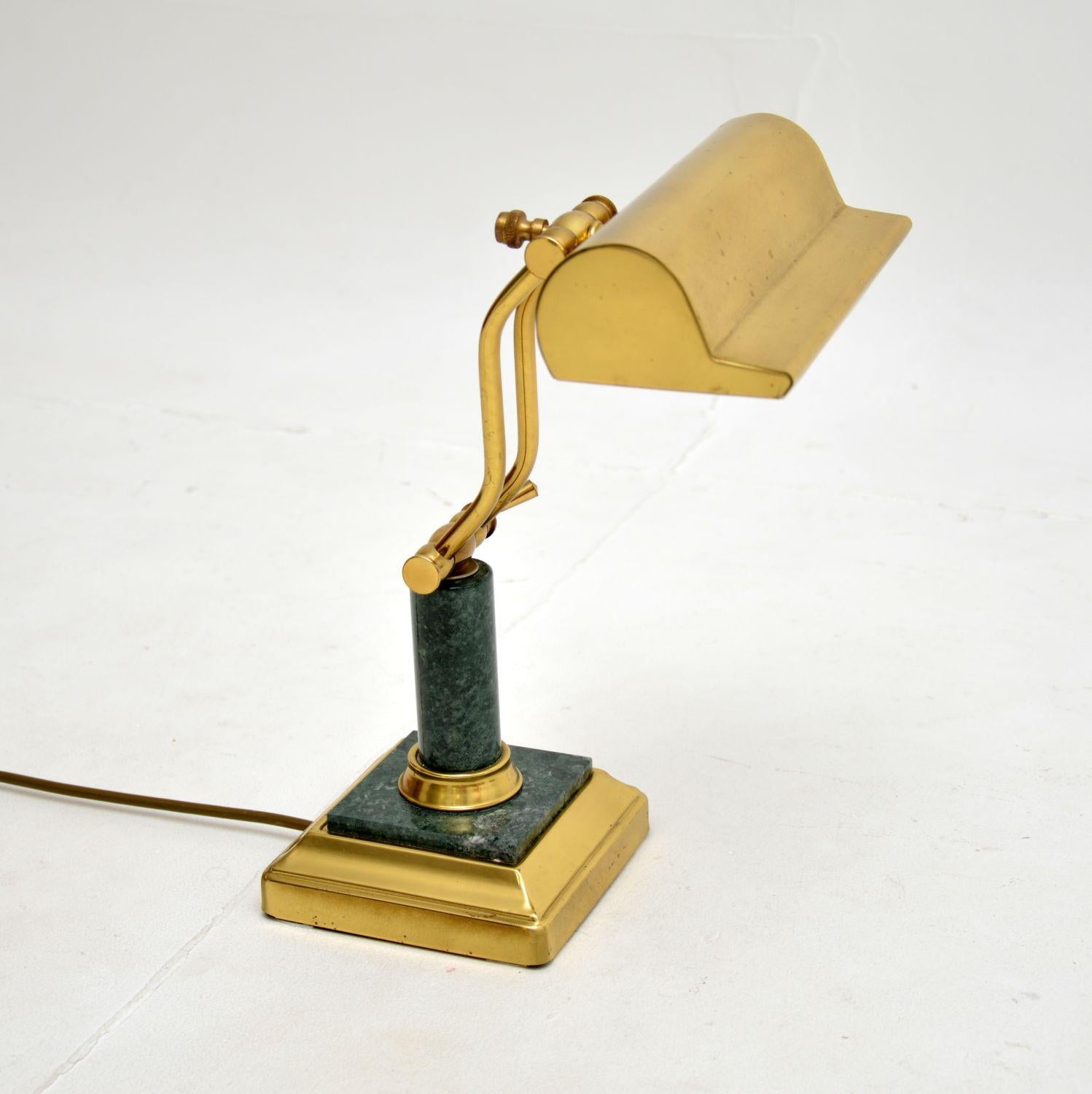A fantastic vintage French art deco desk lamp in brass and marble, dating from around the 1950’s.

It is of superb quality, the solid brass frame is beautifully offset by the green marble. It has a nicely shaped shade which can be tilted to adjust