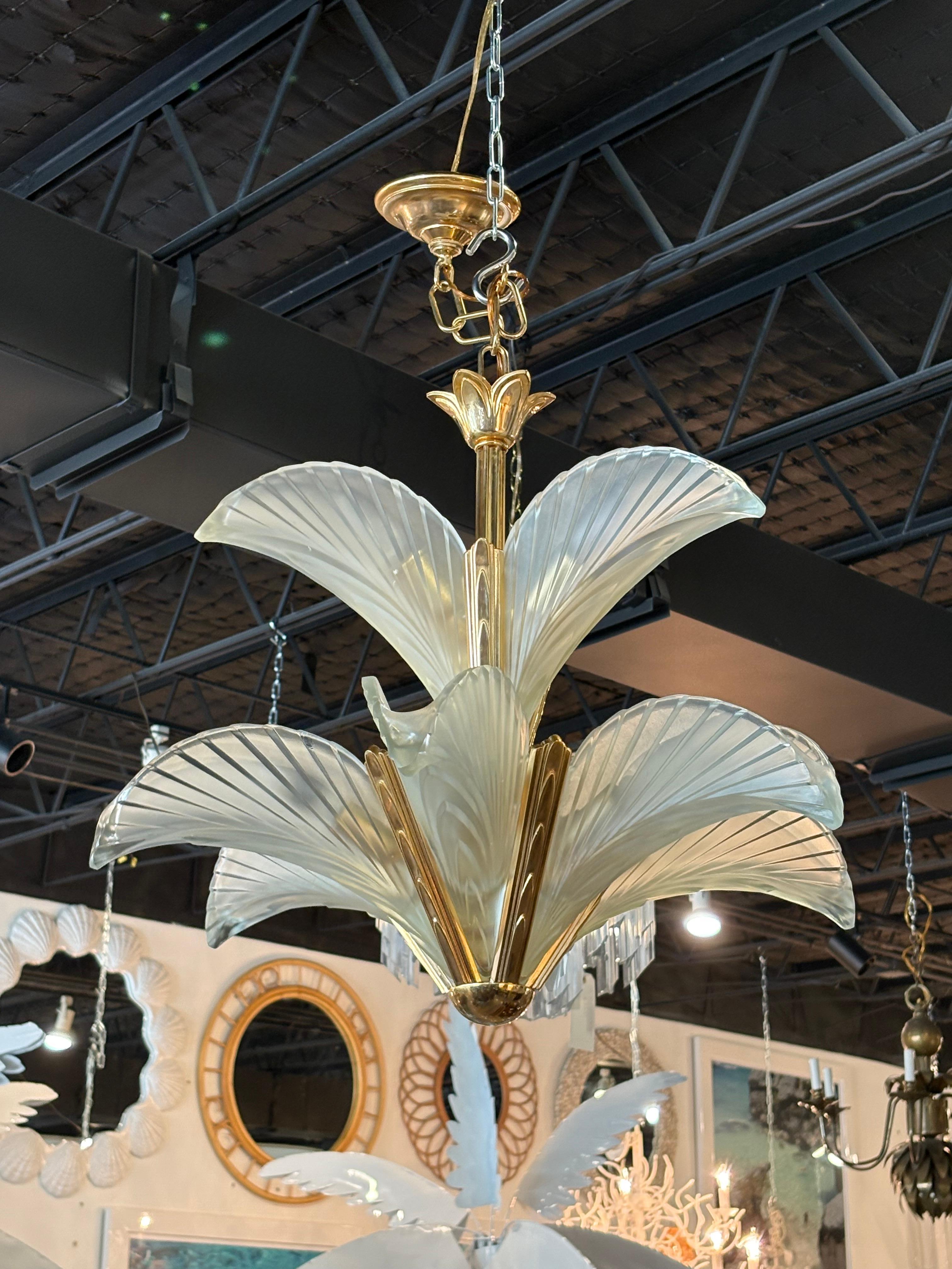 Vintage French Art Deco frosted glass and bronze, brass finish palm tree leaf feather chandelier. Comes with original chain and ceiling canopy. No chips, breaks or damage to the glass leaf pieces. 9 lights. Dimensions of the chandelier are 24 x 24. 