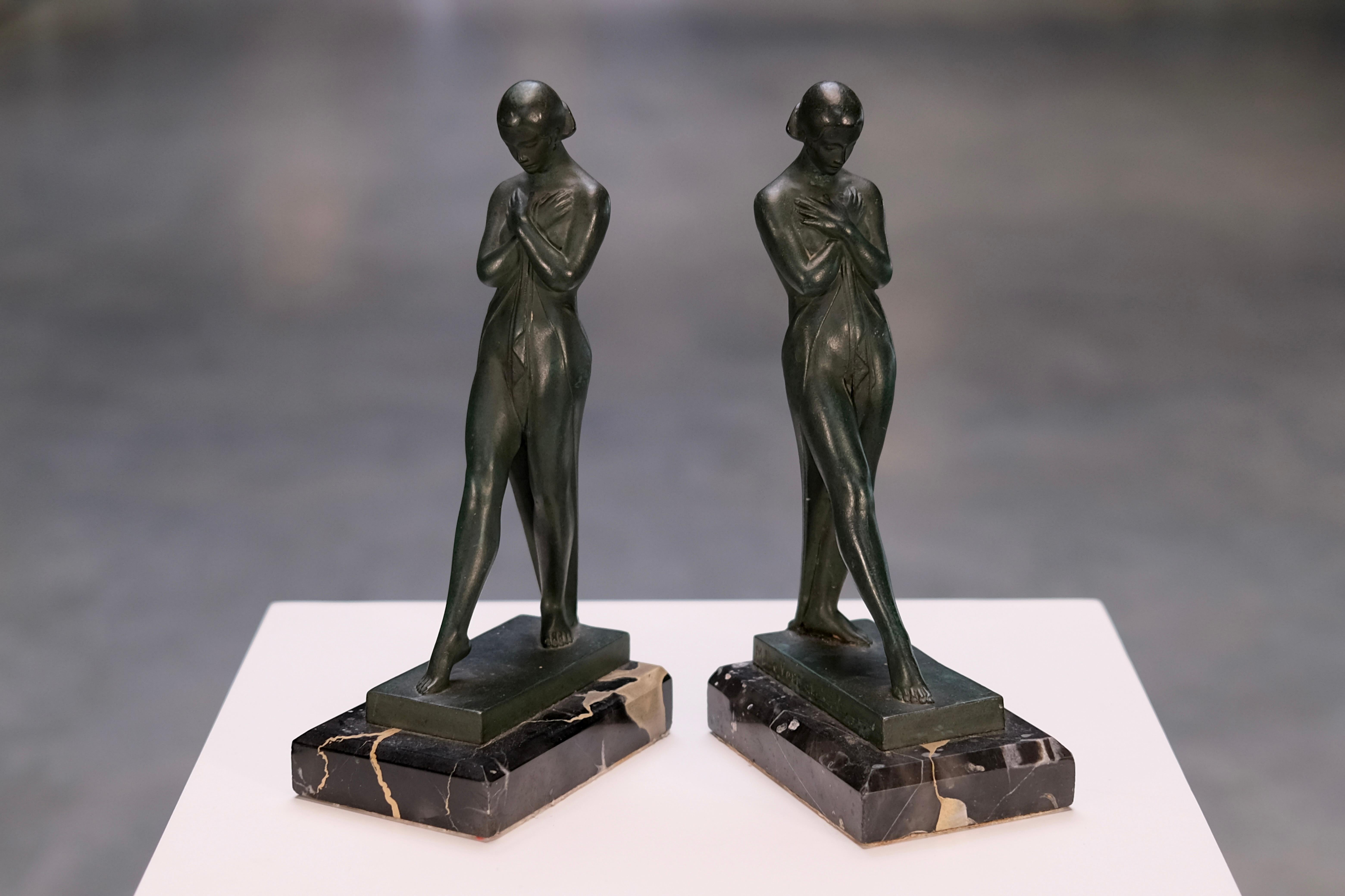 Step into the poetic elegance of the French Art Deco era with this exquisite pair of vintage bookends titled “Meditation”, designed in the 1920s by Fayral — a well-known pseudonym of acclaimed French sculptor Pierre Le Faguays (1892–1962). These