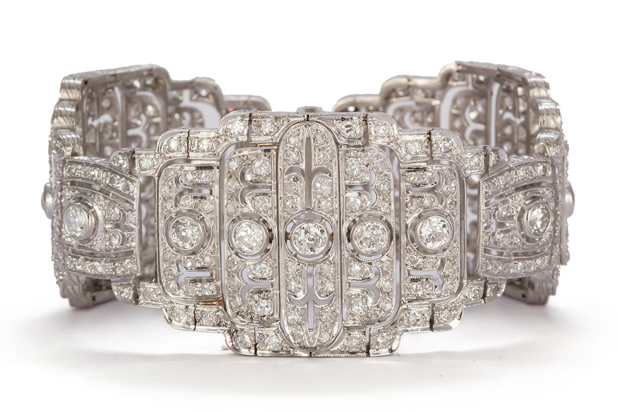 We are pleased to present this Beautiful Vintage French Art Deco Platinum & Diamond Bracelet. It features 7.44CTW F-G/SI1-SI2 Old European Cut diamonds ranging in size from approximately 0.20-0.01cts. They are securely set in this stunning platinum