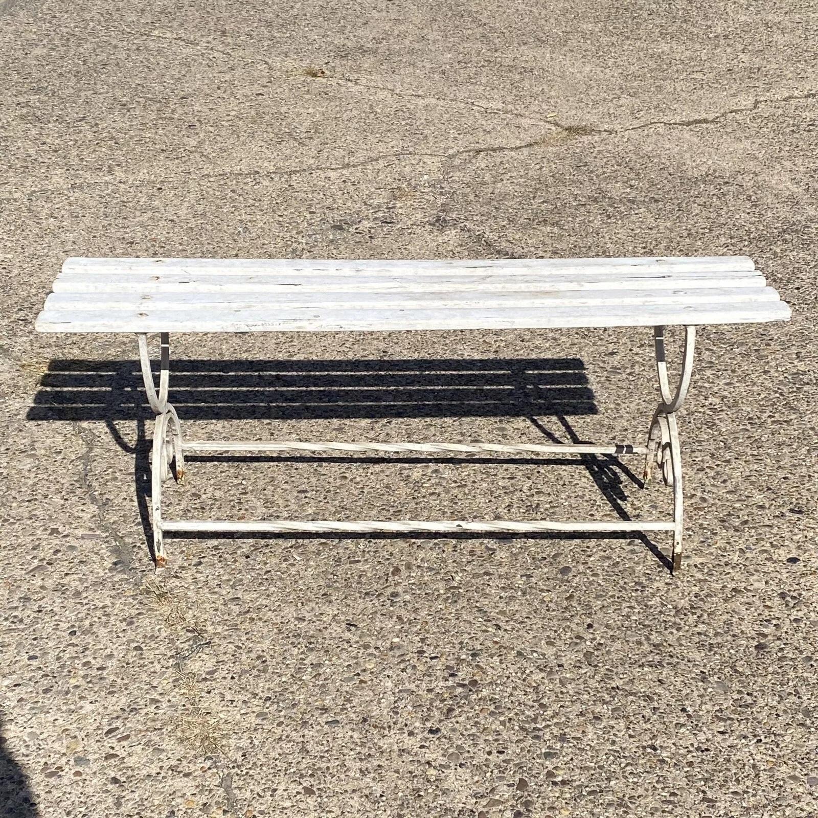 Vintage French Art Nouveau Scrolling Wrought Iron Wooden Slat Seat Garden Patio Bench. Circa Early 20th Century. Measurements: 19.5