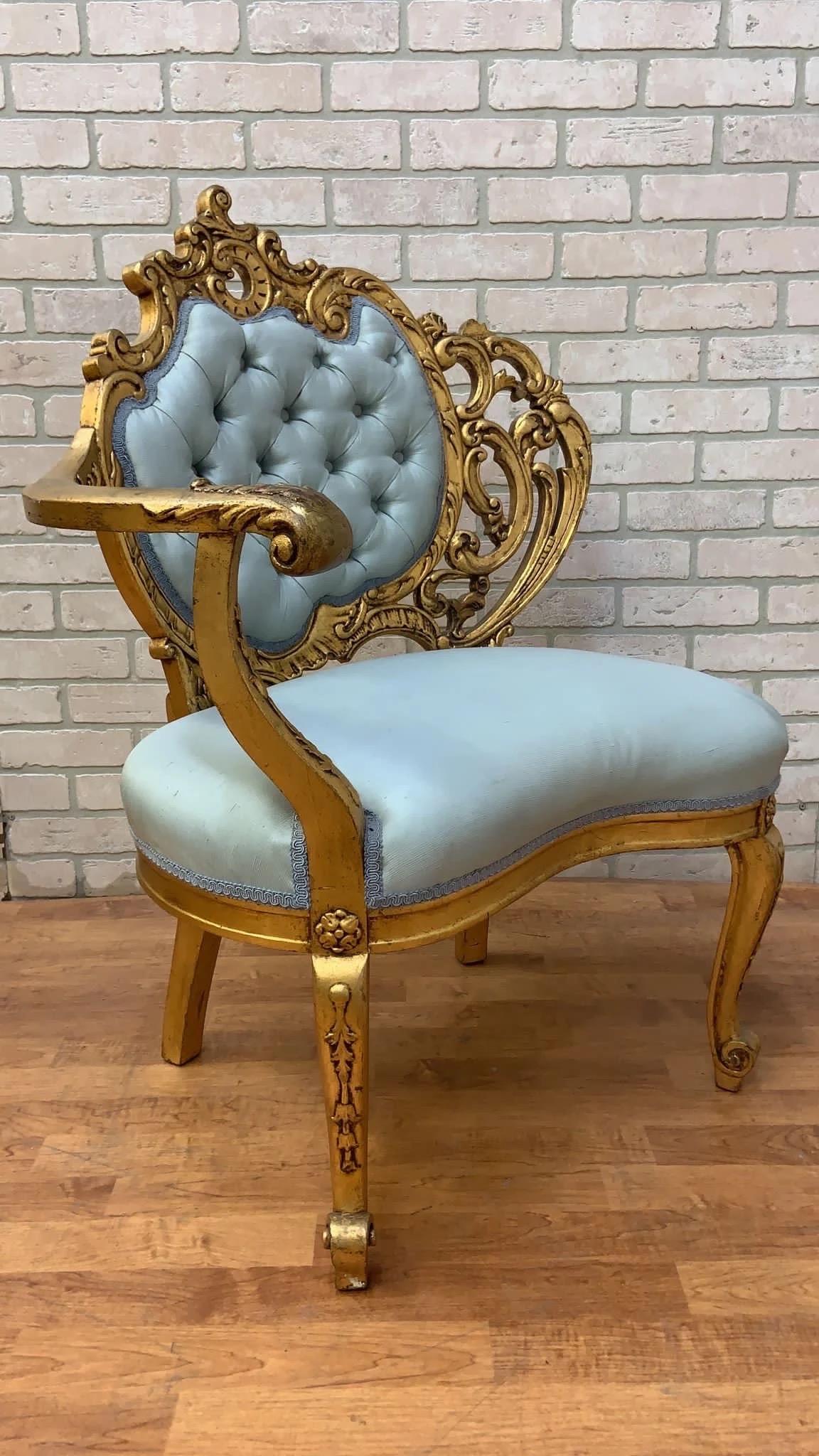 Vintage French Louis Style Carved Asymmetrical Gold-Gilded Baroque Revival Blue Silk Tufted-Back Single Arm Accent Chair 

Our vintage asymmetrical Baroque revival accent chair is a true masterpiece of elegance and sophistication. This chair