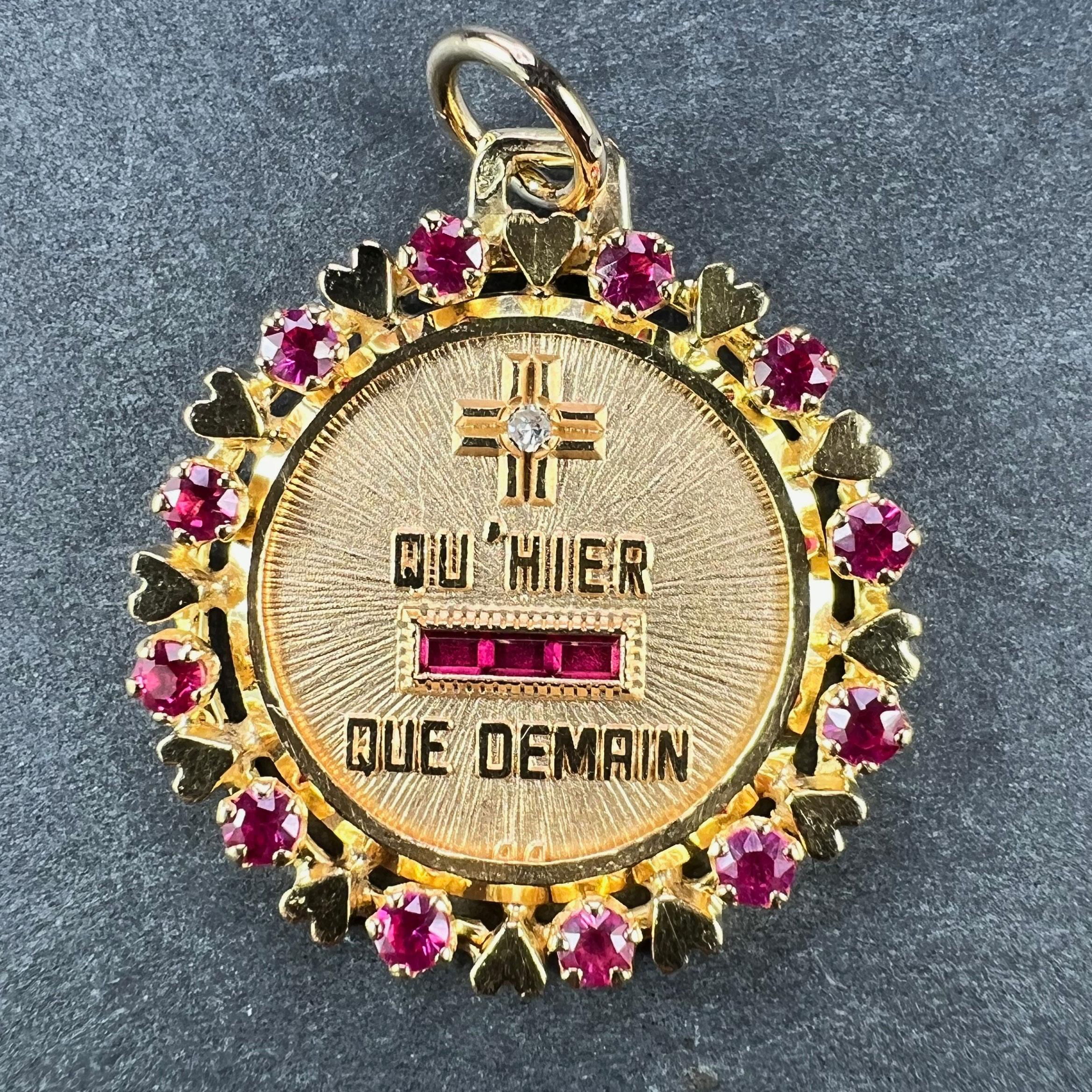 A French 18 karat (18K) yellow gold and ruby love charm pendant with a rebus spelling out 