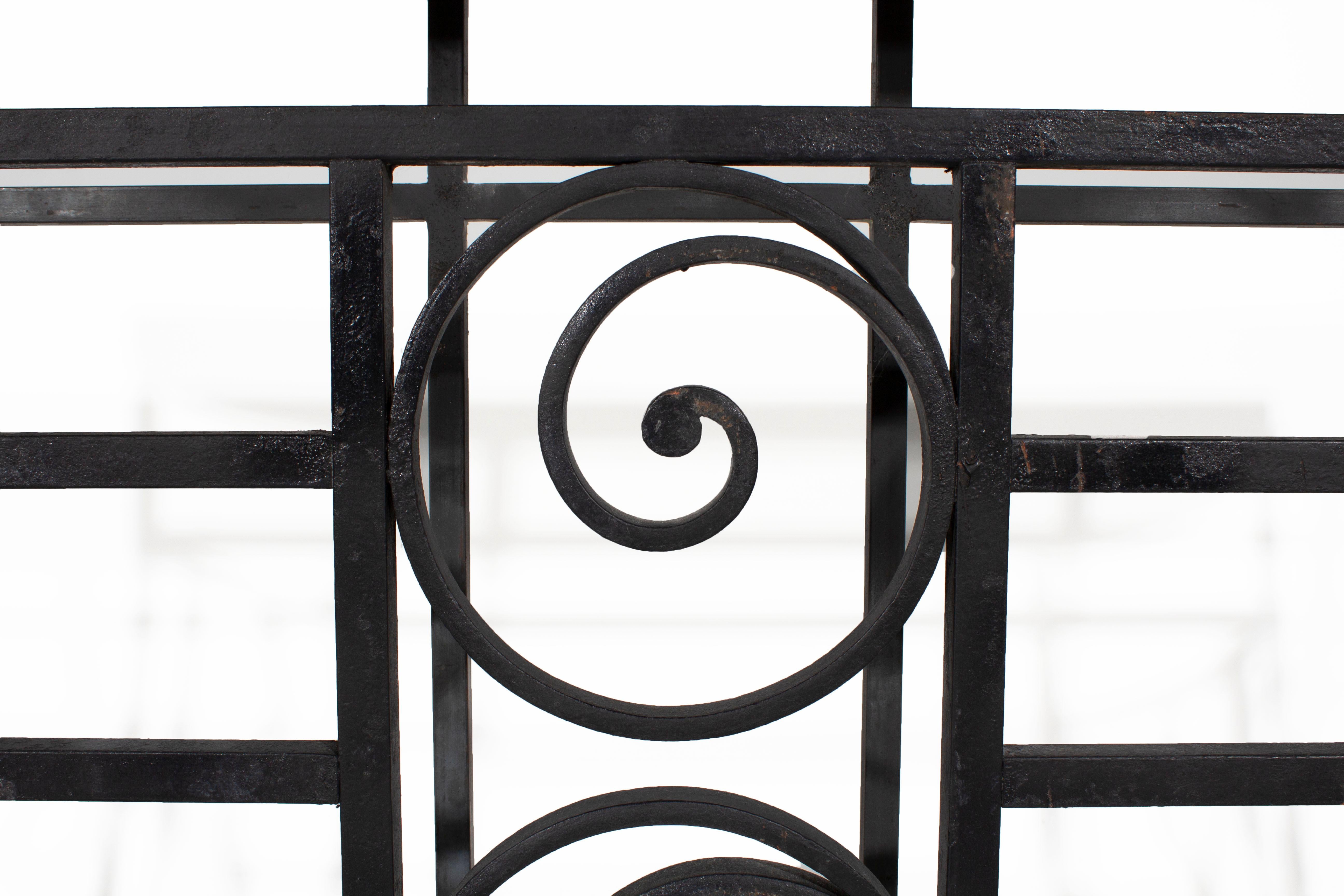 Vintage French balcony railing as console with travertine top.

   