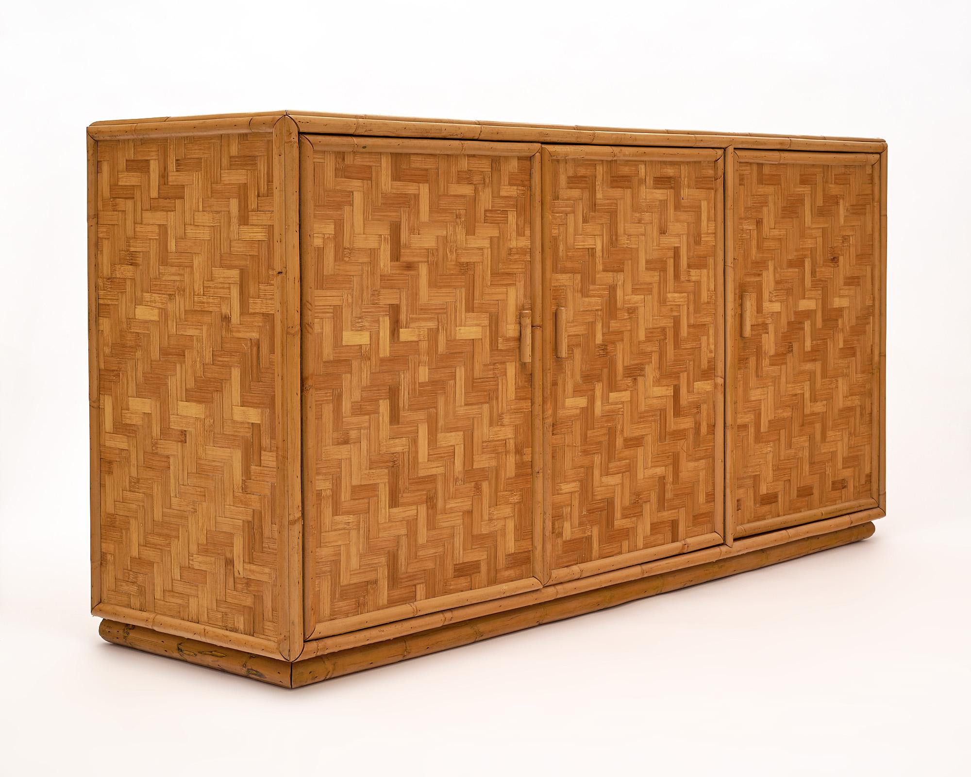 Bamboo buffet, French, finished all around. This credenza features three doors and inside shelving.