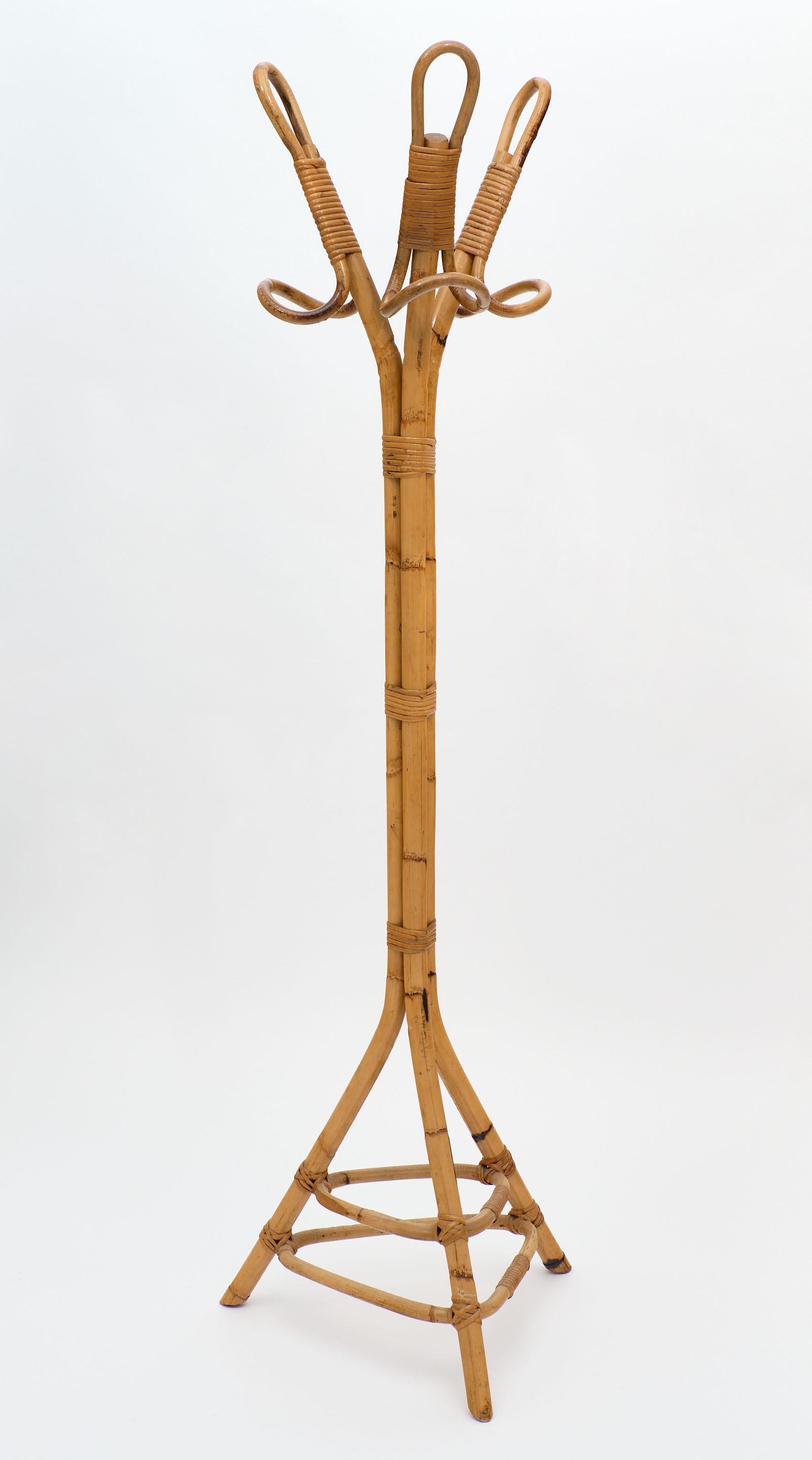 Vintage bamboo French coat rack with a tripod base. We love the sculptural elements of this piece and the strong impact it has!