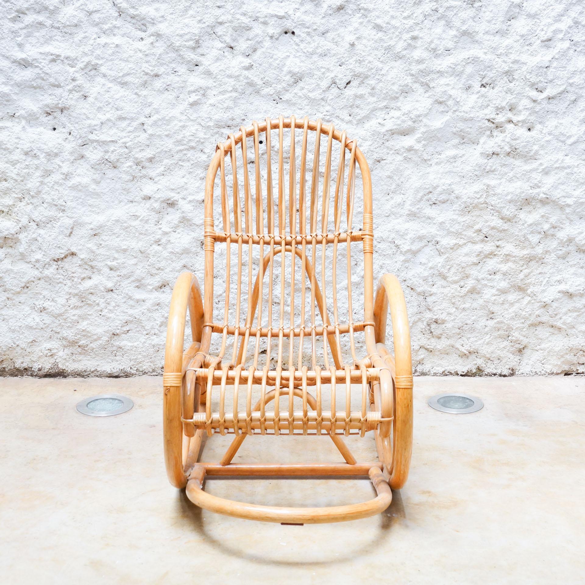 Rocking chair by unknown manufacturer from France, circa 1960.

In original condition, with minor wear consistent with age and use, preserving a beautiful patina.

Material:
Bamboo

Dimensions:
D 112 cm x W 60 cm x H 96 cm.
 