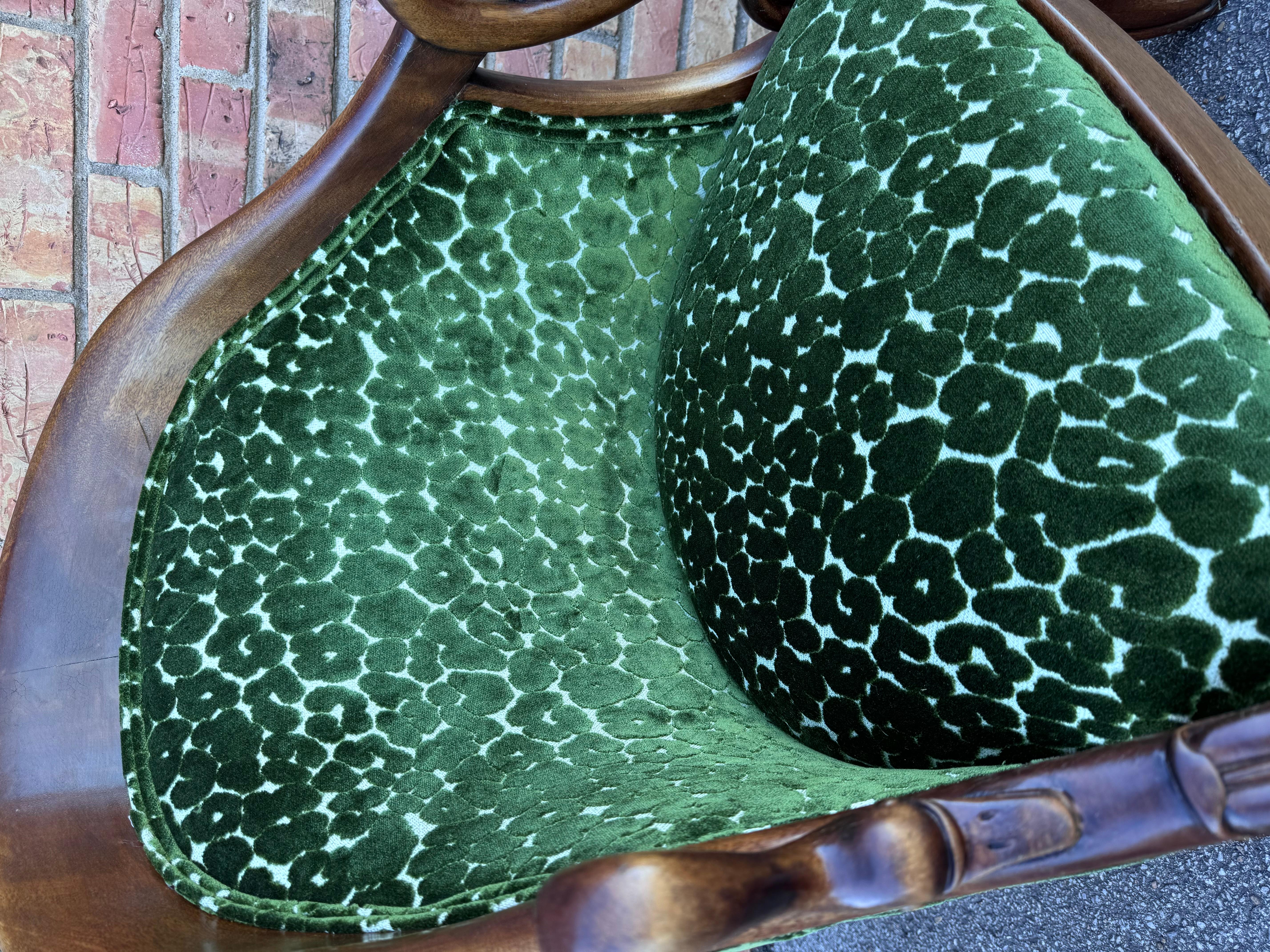 This is a beautiful vintage French barrel back side chair loaded with character. The fabric is a stunning emraled green, crushed velvet material. The base is solid, hand carved wood, rich brown color that pairs wonderfully with the green fabric.