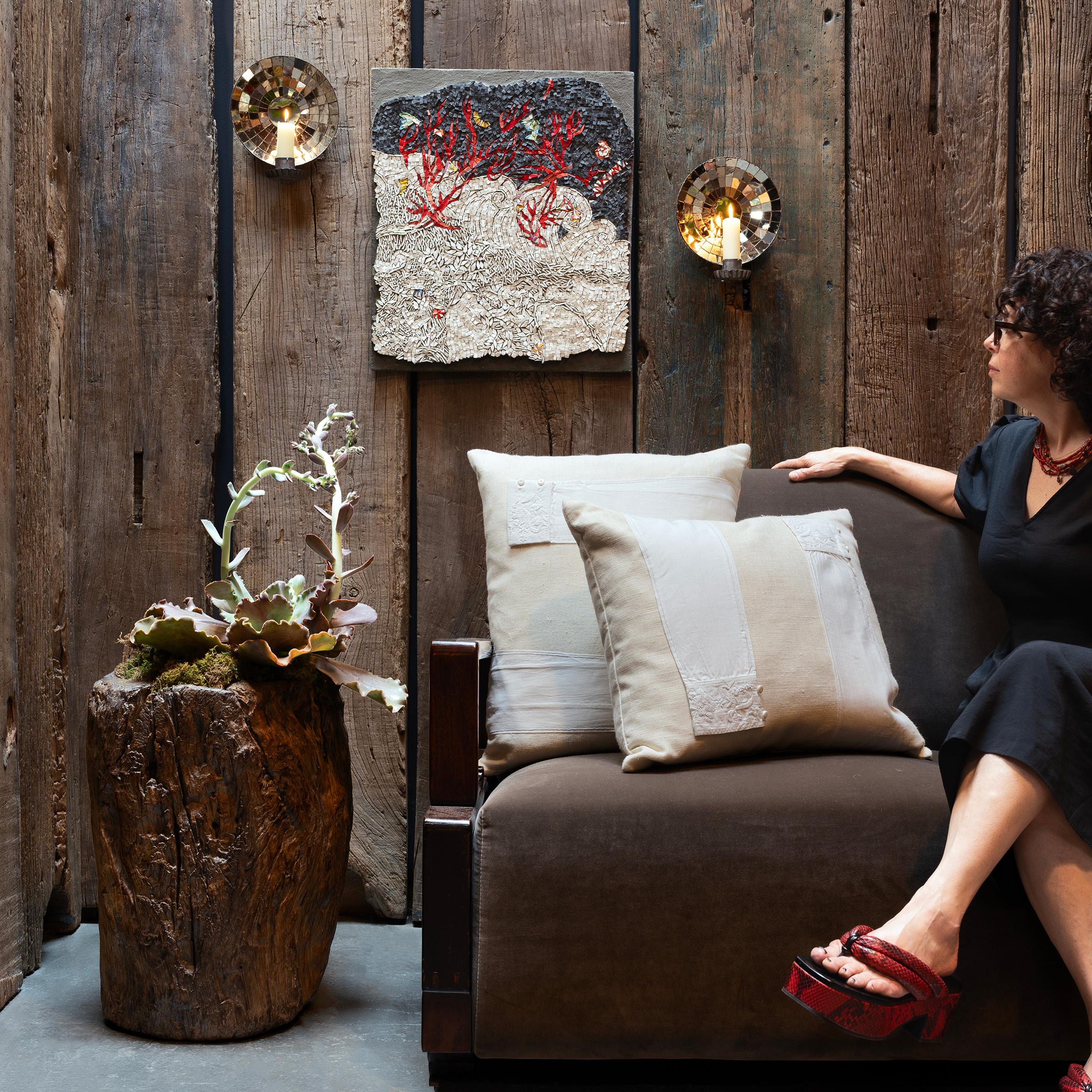 This hand-crafted pillow was designed by a local Chicago artist and textile historian who lovingly repurposes vintage fabrics, garments and embroidery fragments collected during her travels. Sewn from crème white Belgian linen, this down-filled