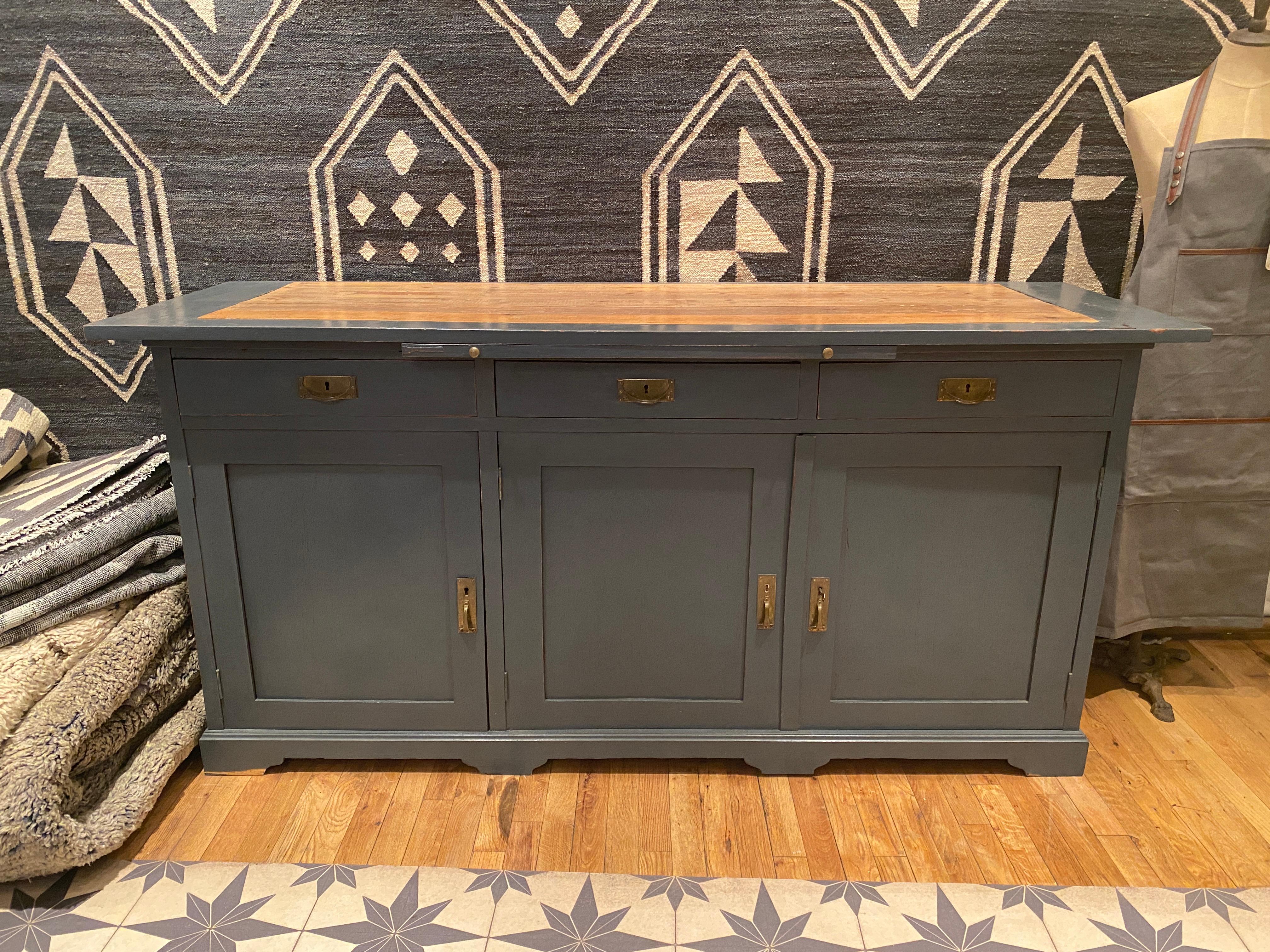 A welcoming vintage French credenza with original blue-grey paint is perfect for a home that utilizes every space possible. May be used in a high traffic hallway or a vintage kitchen.