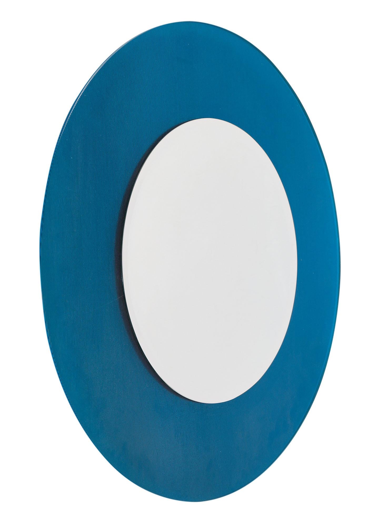 Large French modernist round mirror with striking blue glass frame surrounding a beveled mirror.