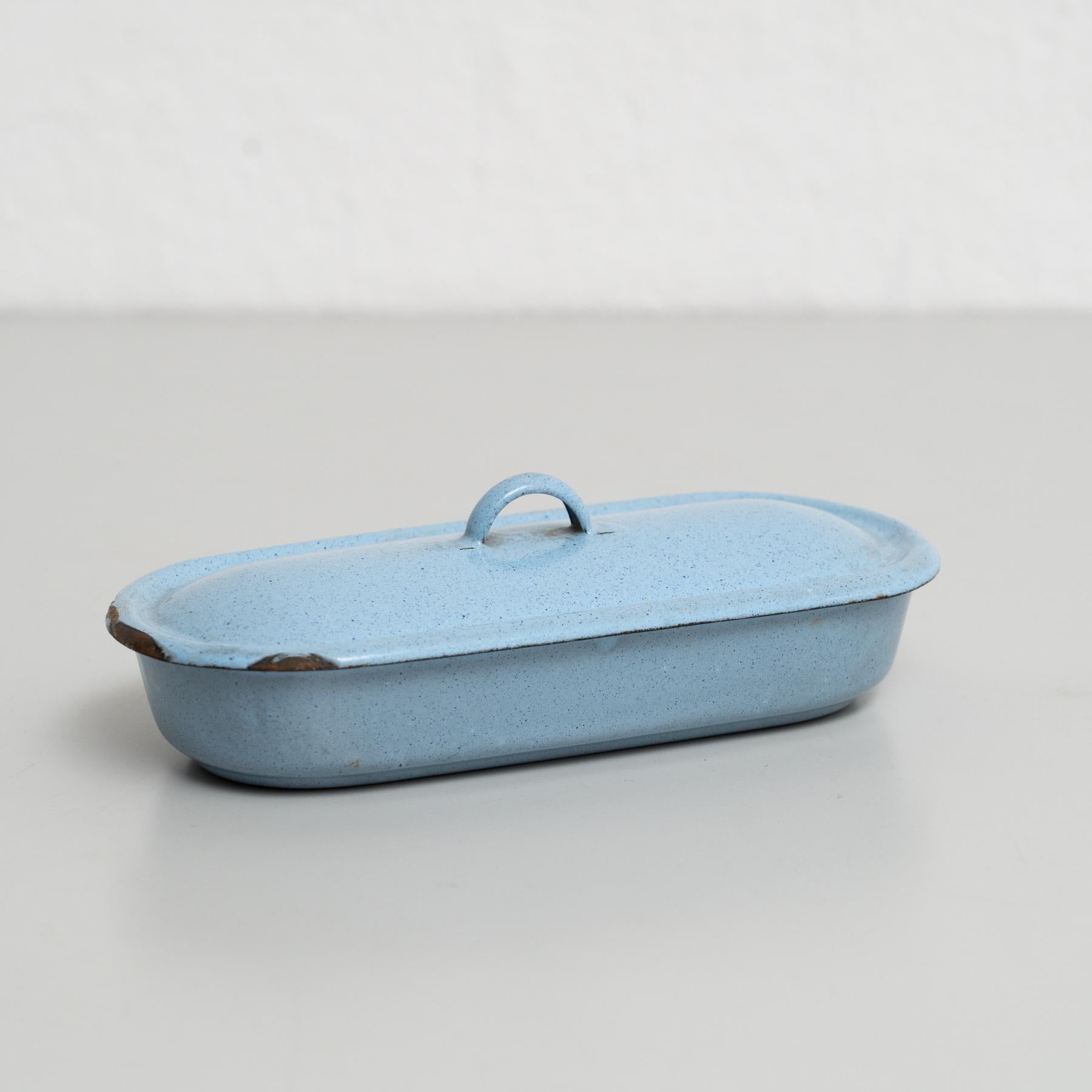 This elegant early 20th-century metal tray, lacquered in a striking blue, was manufactured in France circa 1940. The tray comes with a matching lid, or 