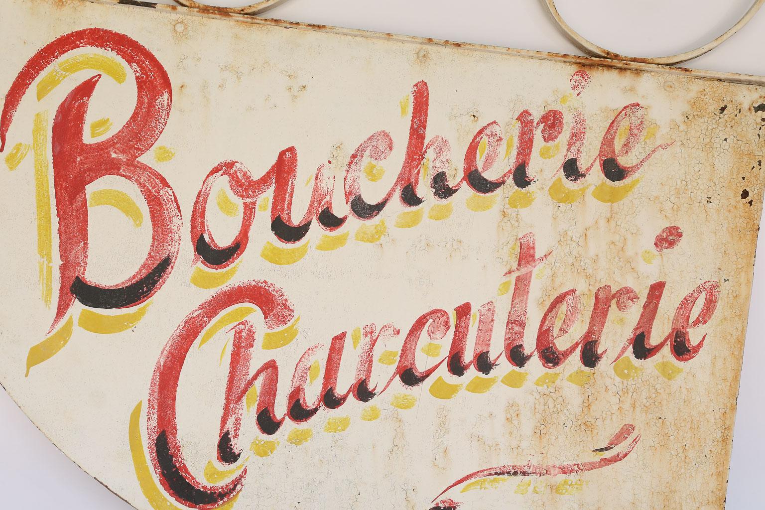 This is a hand painted Boucherie Charcuterie French sign. It once hung in a French butcher shop. French to English translation: Boucherie - Butchery; Charcuterie - Delicatessen. This piece is perfect for a kitchen or restaurant.