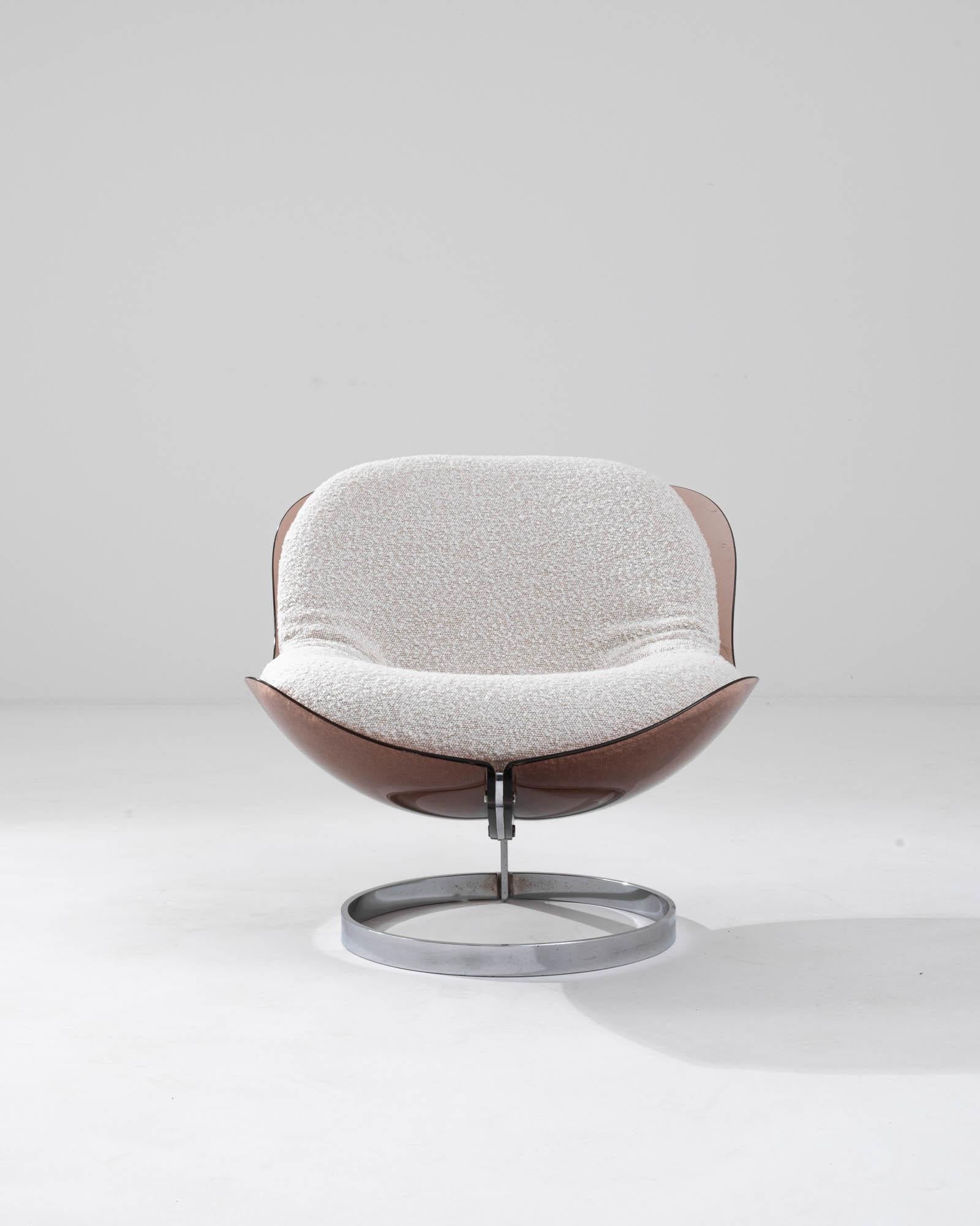 An upholstered metal and plexiglass “Sphere” chair designed by Boris Tabacoff, circa 1971. Raised above a chrome metal base, sumptuously curved smoked plexiglass cradles a plush boucle upholstered cushion. The sleek futuristic design is a staple of