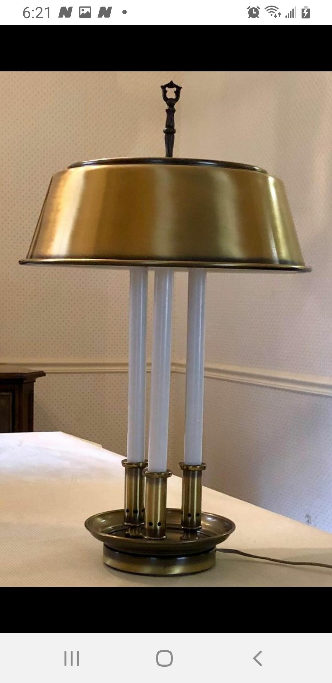 Vintage French game table style, bouilotte style desk lamp. 23 inches tall this antique or burnished brass desk lamp has a 6 inch base holding up 3 tall faux candles, the actual light comes from a double cluster at the top of the central stem . the