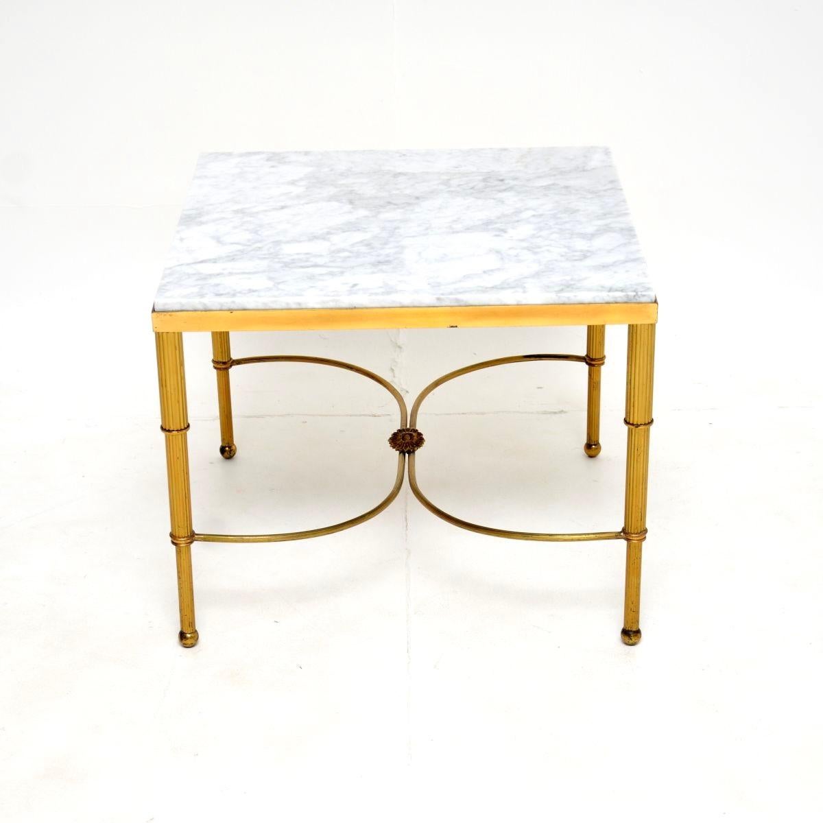 An excellent vintage French brass and marble coffee / side table. This was made in France, it dates from around the 1950’s.

The quality is fantastic, the brass frame has beautifully curved stretchers with a lovely connecting brass rosette, and