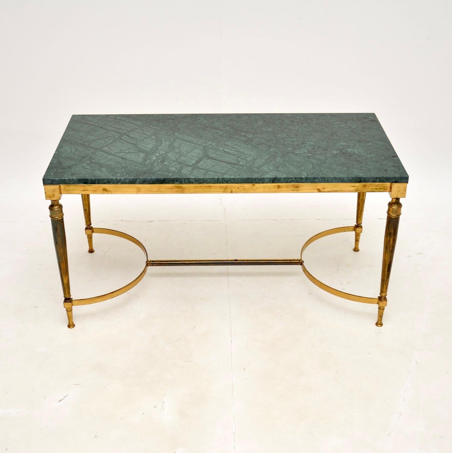 A stylish and very well made vintage French brass and marble coffee table. This was made in France, it dates from around the 1970’s.

The quality is fantastic, the solid brass frame is very well made with a wishbone stretcher between the legs for