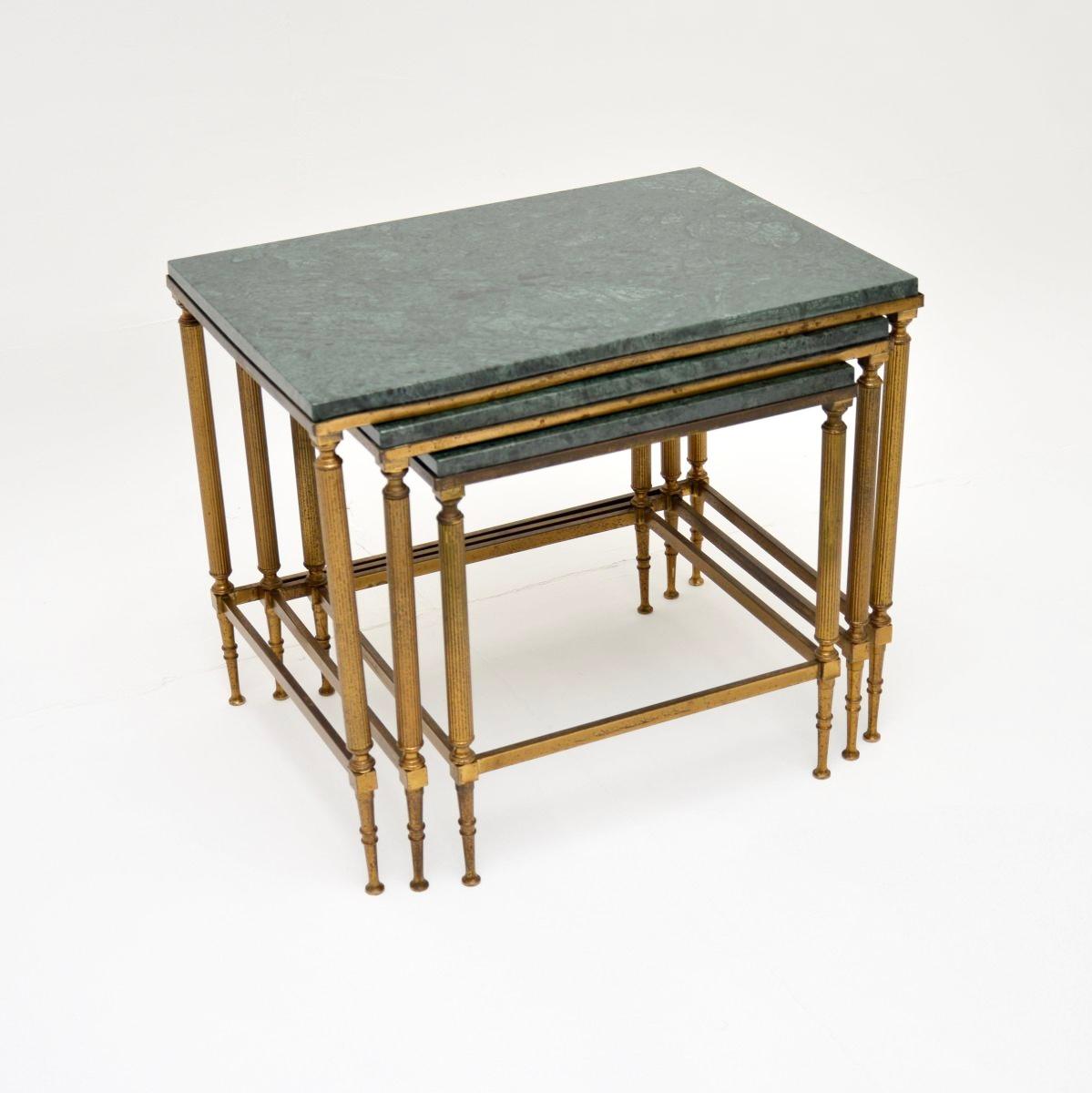 A fantastic vintage French brass and marble nest of tables, dating from the 1960-70’s.

They are of superb quality and have a very practical design. The tables nest under one another nicely, each has a beautifully constructed solid brass frame with