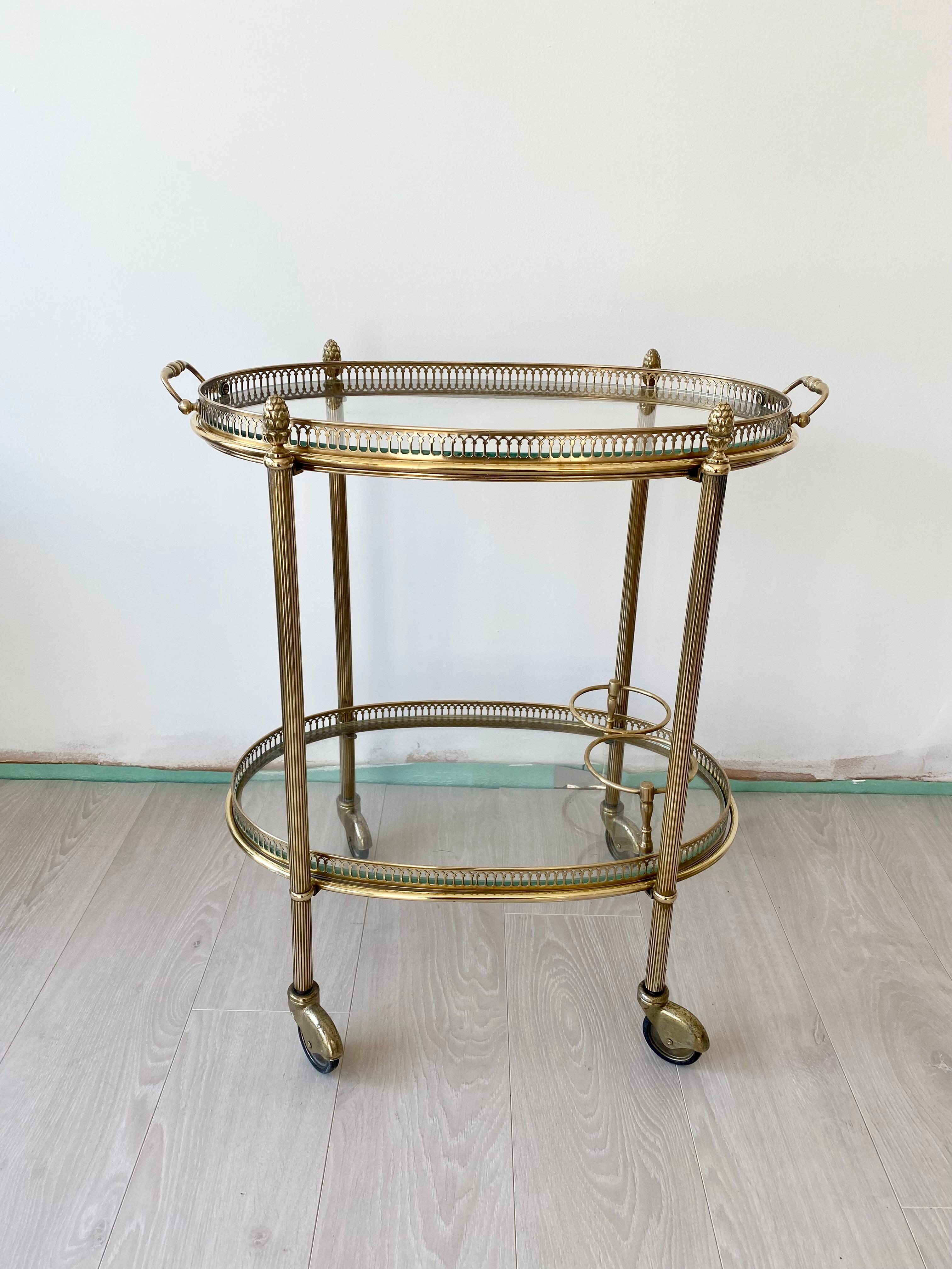 Perfect for smaller spaces, this vintage brass cocktail trolley from France circa 1950

Lift off top tray and bottle holder to lower tier

Polished brass frame

The trolley measures 60cm tall, 55cm wide and 38cm deep - these are its widest