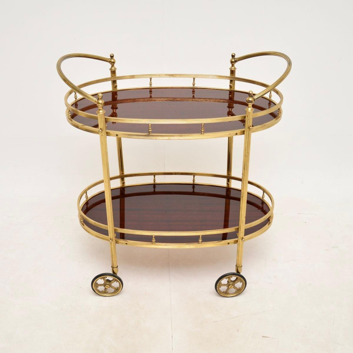 A fabulous vintage French brass drinks trolley. This was recently imported from France, it dates from the 1970’s.

It is of superb quality, with a beautiful fluted legs with finials, galleries around the top and lower tiers and large sweeping