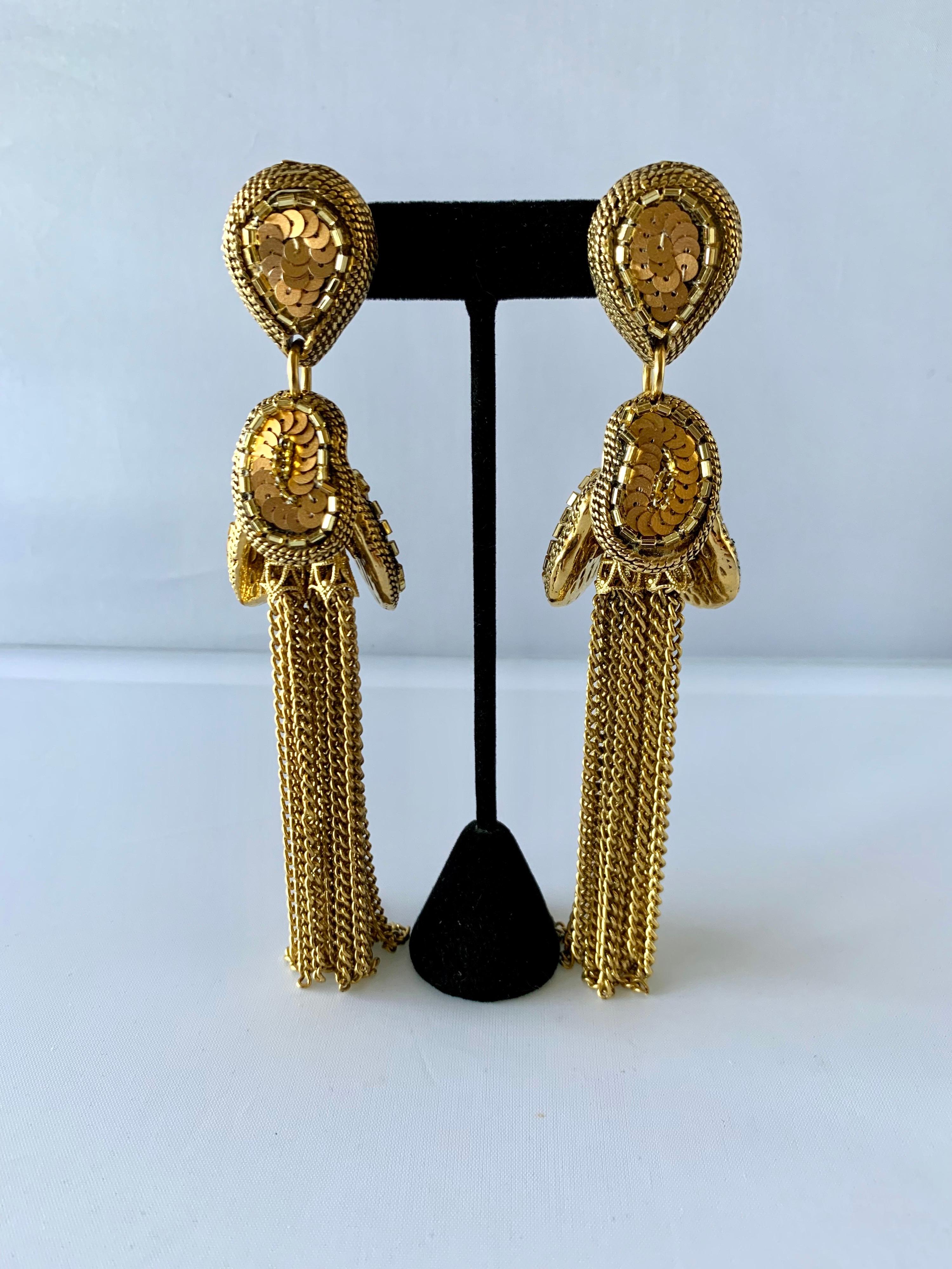 Dramatic vintage French beaded gold-chain tassel clip-on earrings. The earrings are intricately beaded, signed Satellite Paris. 