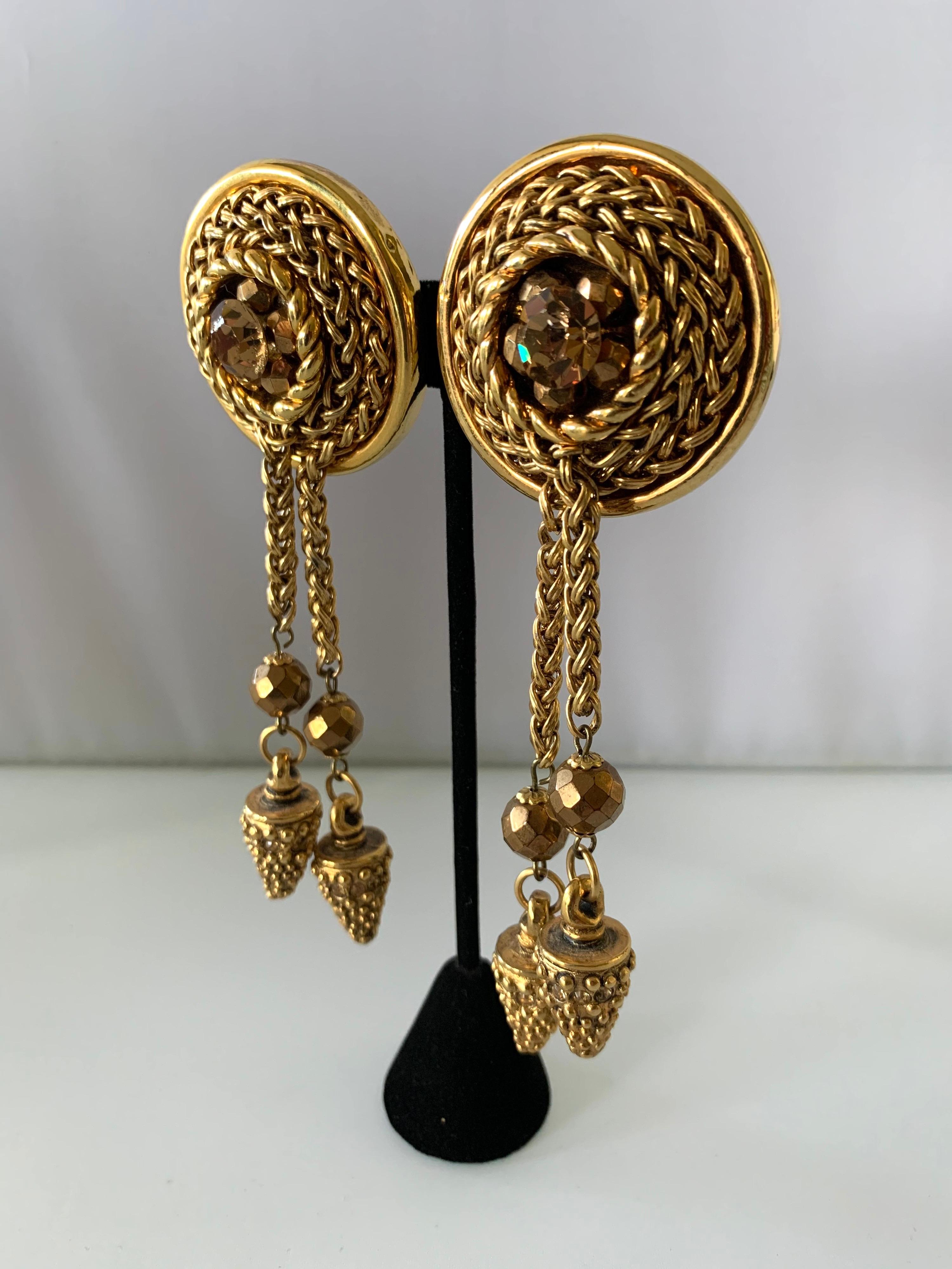 Vintage oversized bronze double tassel statement clip-on earrings by Claire Deve Paris - circa 1980 accented by large bronze glass faceted rhinestones and beads.