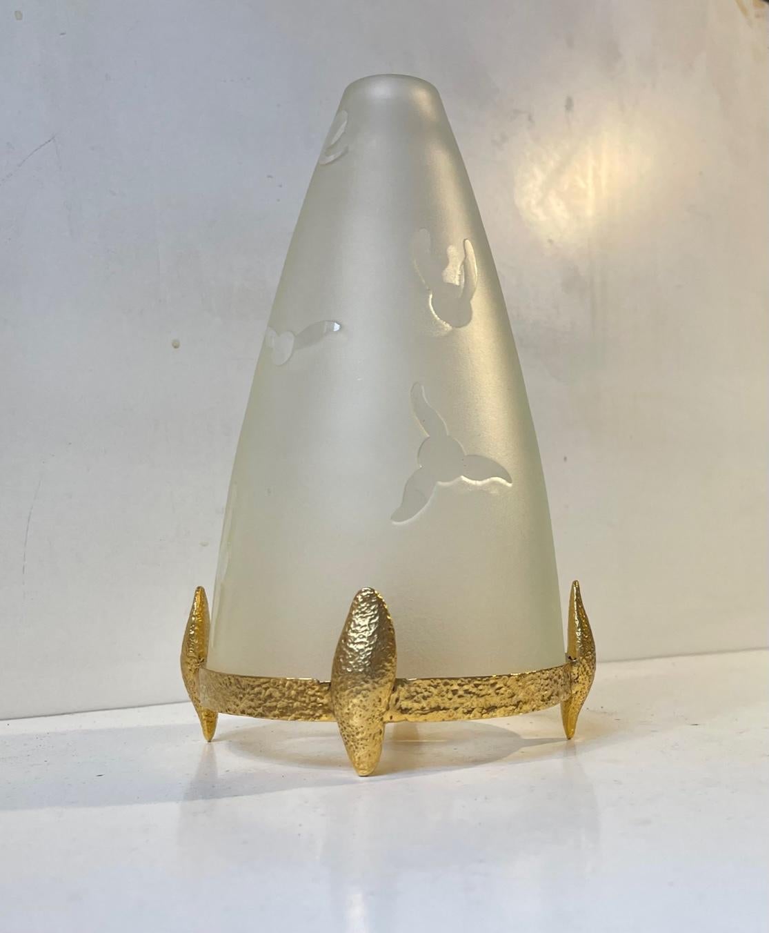 A French candle table lamp featuring a Tristan base in gilded brass and a thick glass shade decorated with birds. Imprint/marking from unidentified French Work shop. Signed made in France as well. It can be fitted with regular sized candles, ball