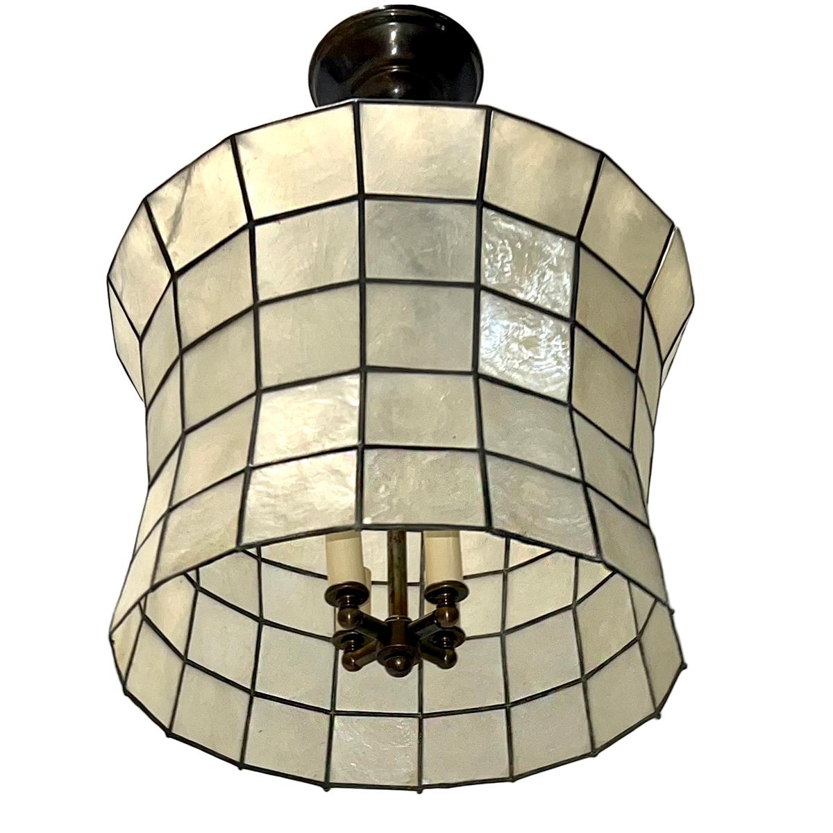 A circa 1960 French capiz lantern with interior lights.

Measurements:
Diameter: 14
