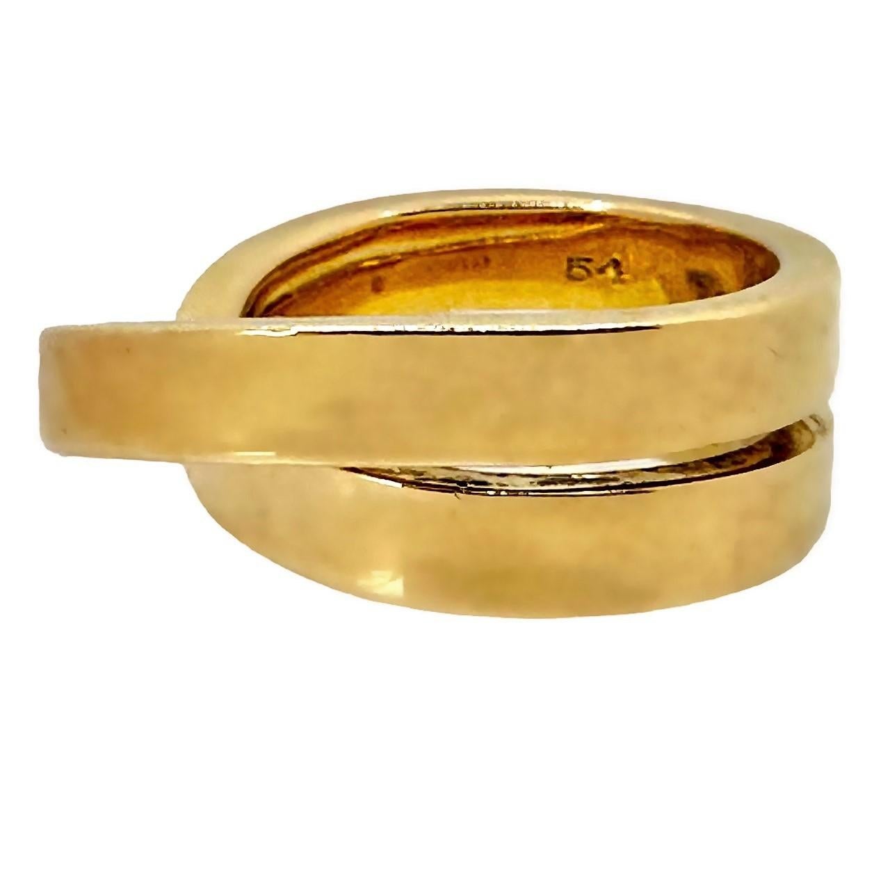 This dynamic and interesting Nouvelle Vague ring is a somewhat unusual offering from this venerated house. Consisting of one continuous ribbon of high polish, 18K yellow gold that wraps around the finger and arcs up high above the finger. It is