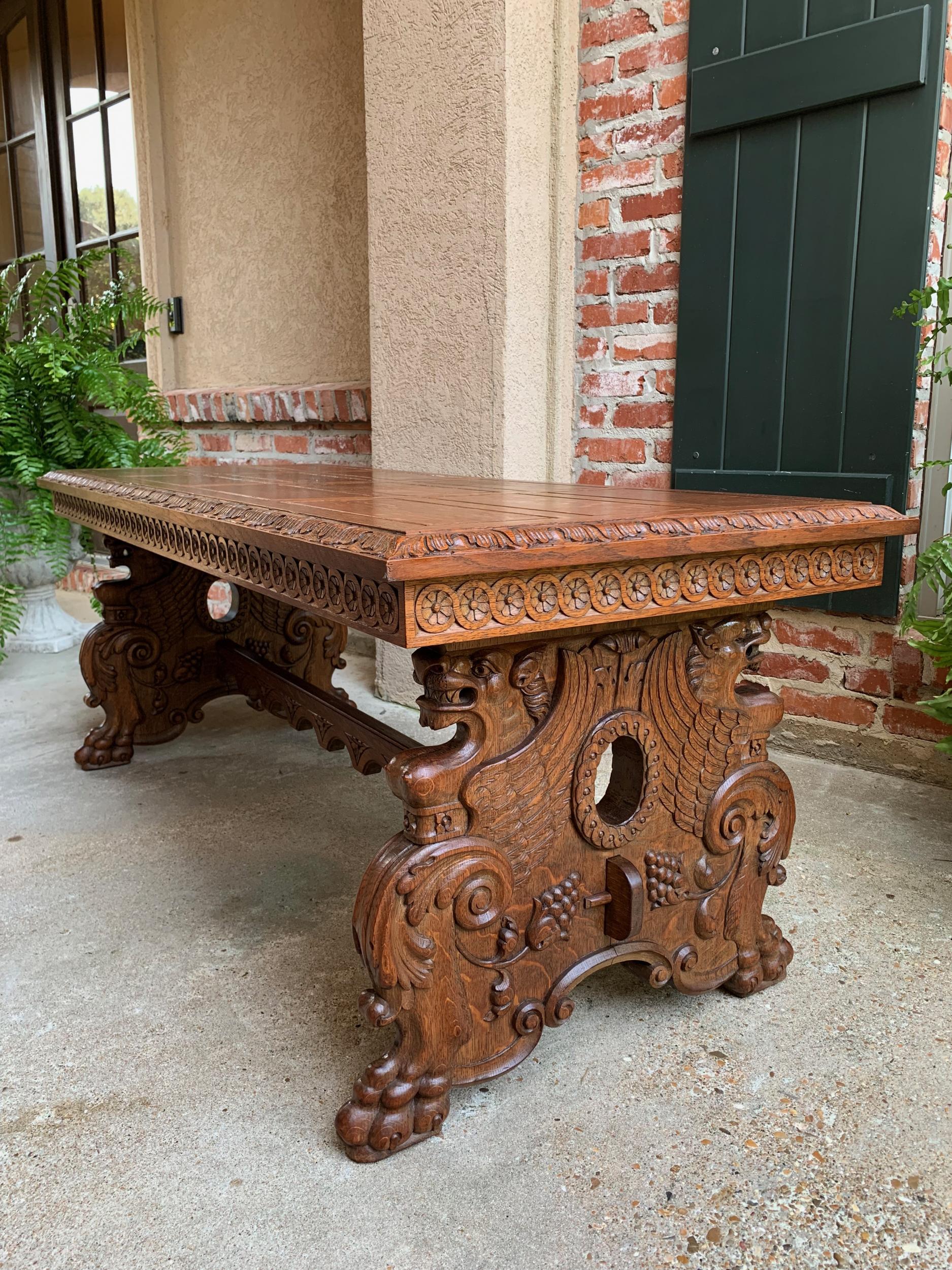 Vintage French CArved oak coffee cocktail table Renaissance Griffin mid century

~Direct from France~
~Large, highly carved vintage French coffee/cocktail table, over 5 ft. length!~
~Paneled, tiger oak top has large, carved beveled edge, above
