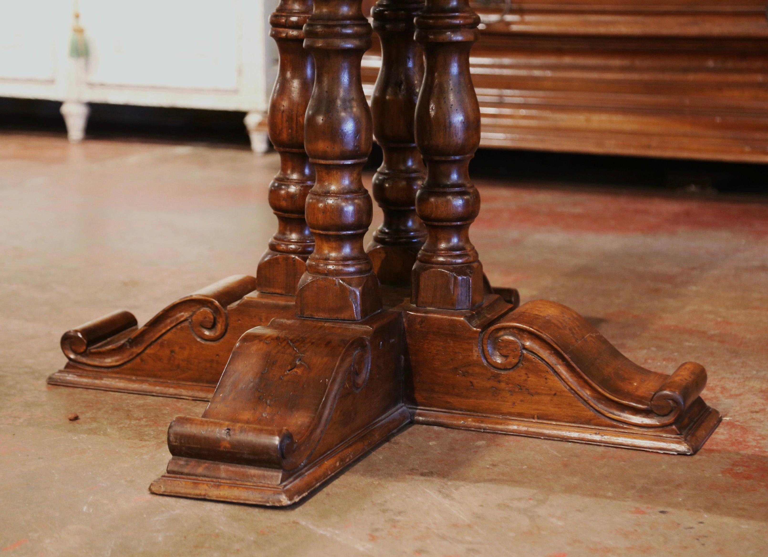 antique dining table with a pedestal base