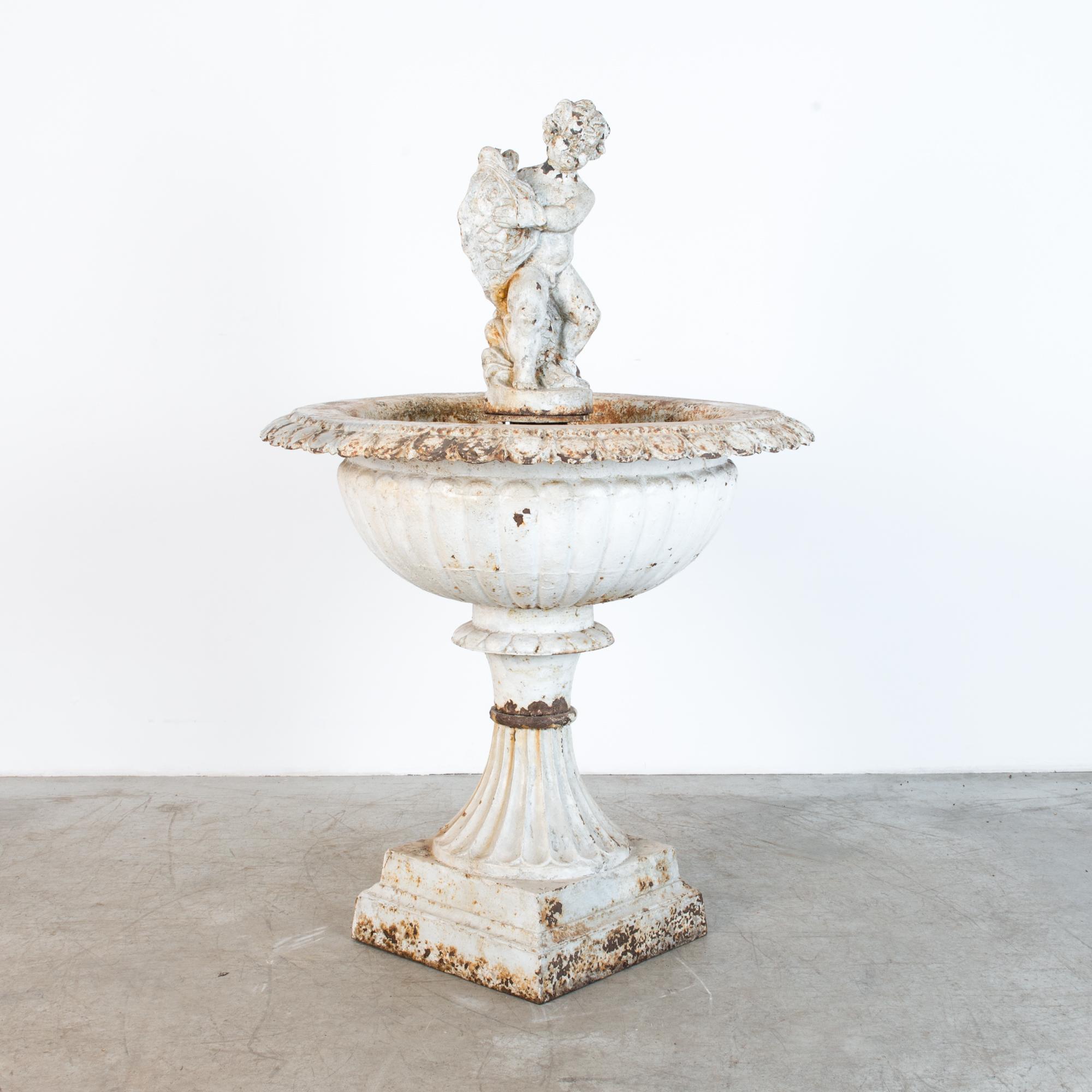 This large fountain, at 58” high, is built from three cast iron parts, in oxidised white finish from France, circa 20th century. In a French Baroque style, this large urn features decorative floral details, and figurative statue, originally fitted
