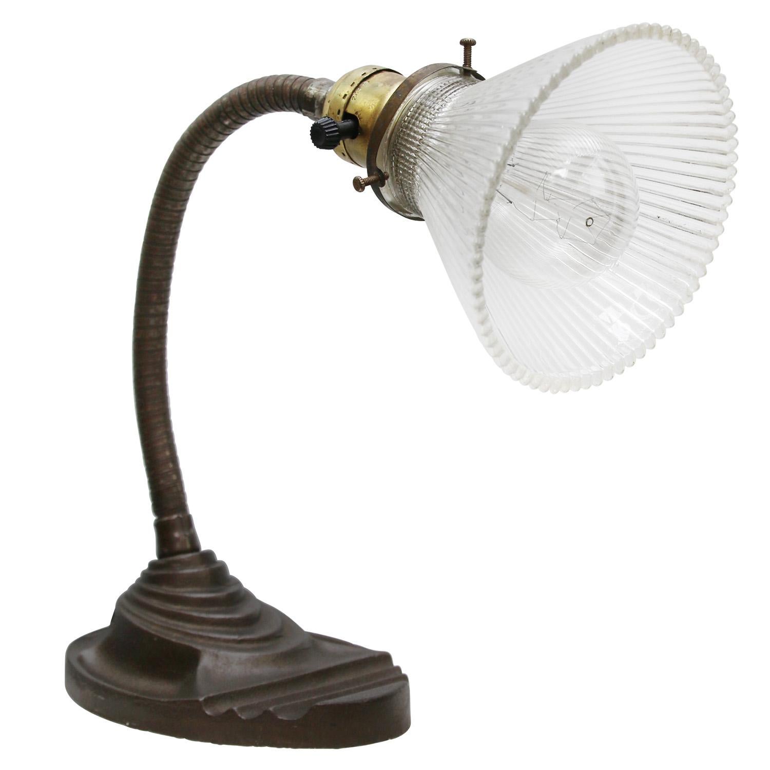 French cast iron desk light.
Cast iron Base and arm with holophane glass shade.
Black cotton wire and plug.

Also, available with US/UK plug

Priced per individual item. All lamps have been made suitable by international standards for