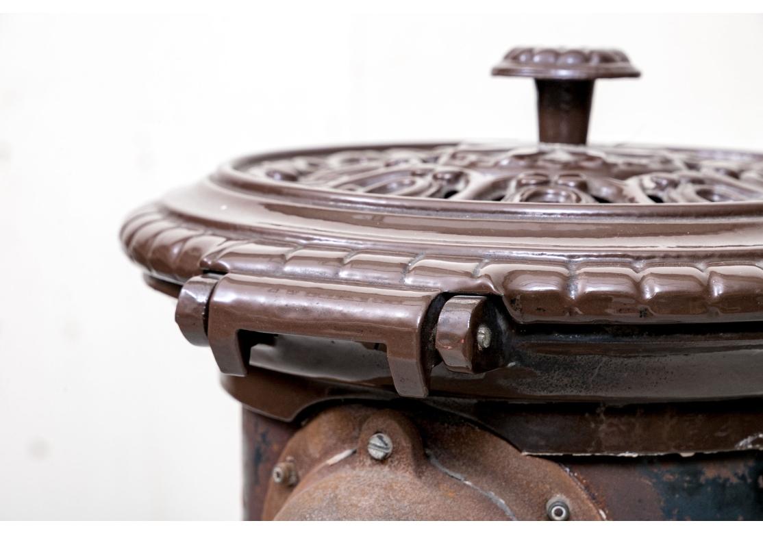 Vintage French Cast Iron Stove Cast Iron Enameled Stove By Ae. Mon. Godin In Distressed Condition For Sale In Bridgeport, CT