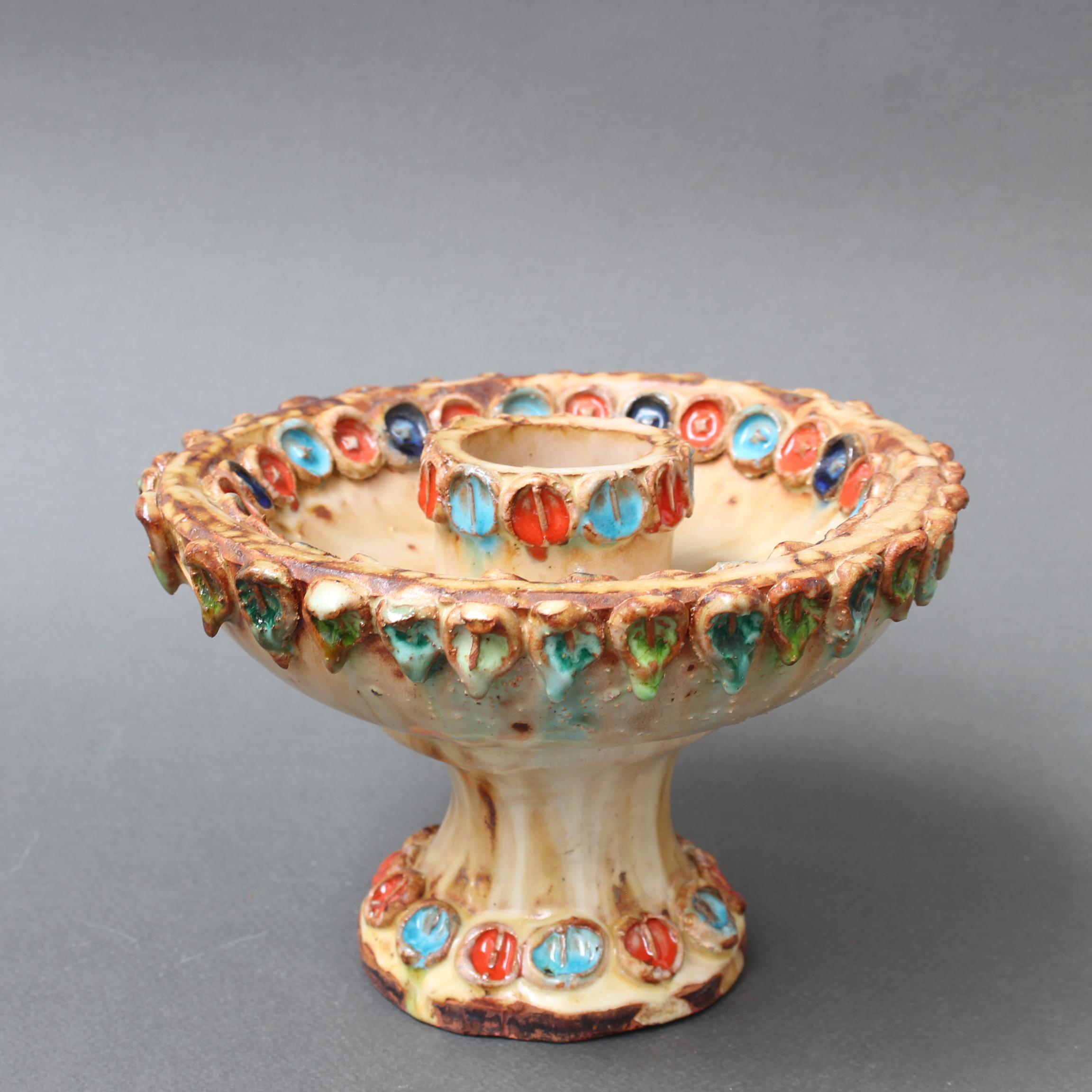 Vintage French ceramic flower-motif candle-holder by La Roue, Vallauris, France (circa 1960s). A charming, decorative piece with rustic and colourful details throughout. The ceramic is of a small scale designed to resemble a small village's