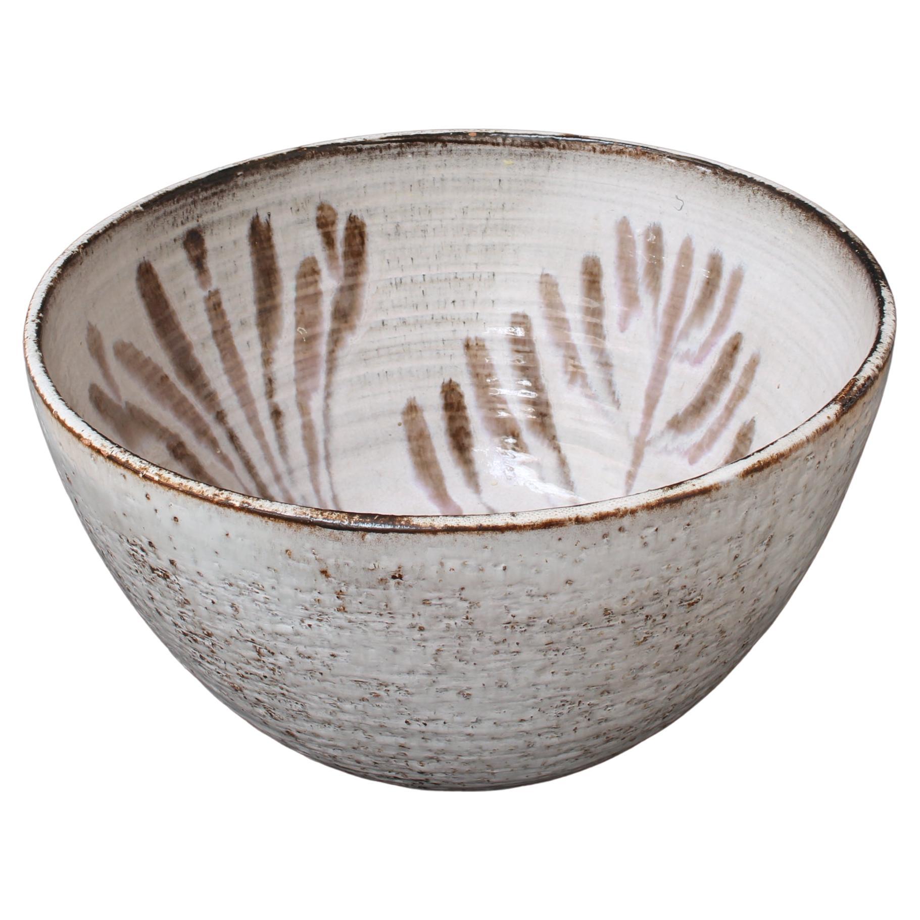 Vintage French ceramic bowl by Gérard Hofmann (circa 1950s). Exquisitely decorated with an interior plant motif in an earthy, enamelled brown, this sizeable bowl makes a statement in the kitchen or on display in another room. Not only is it visually