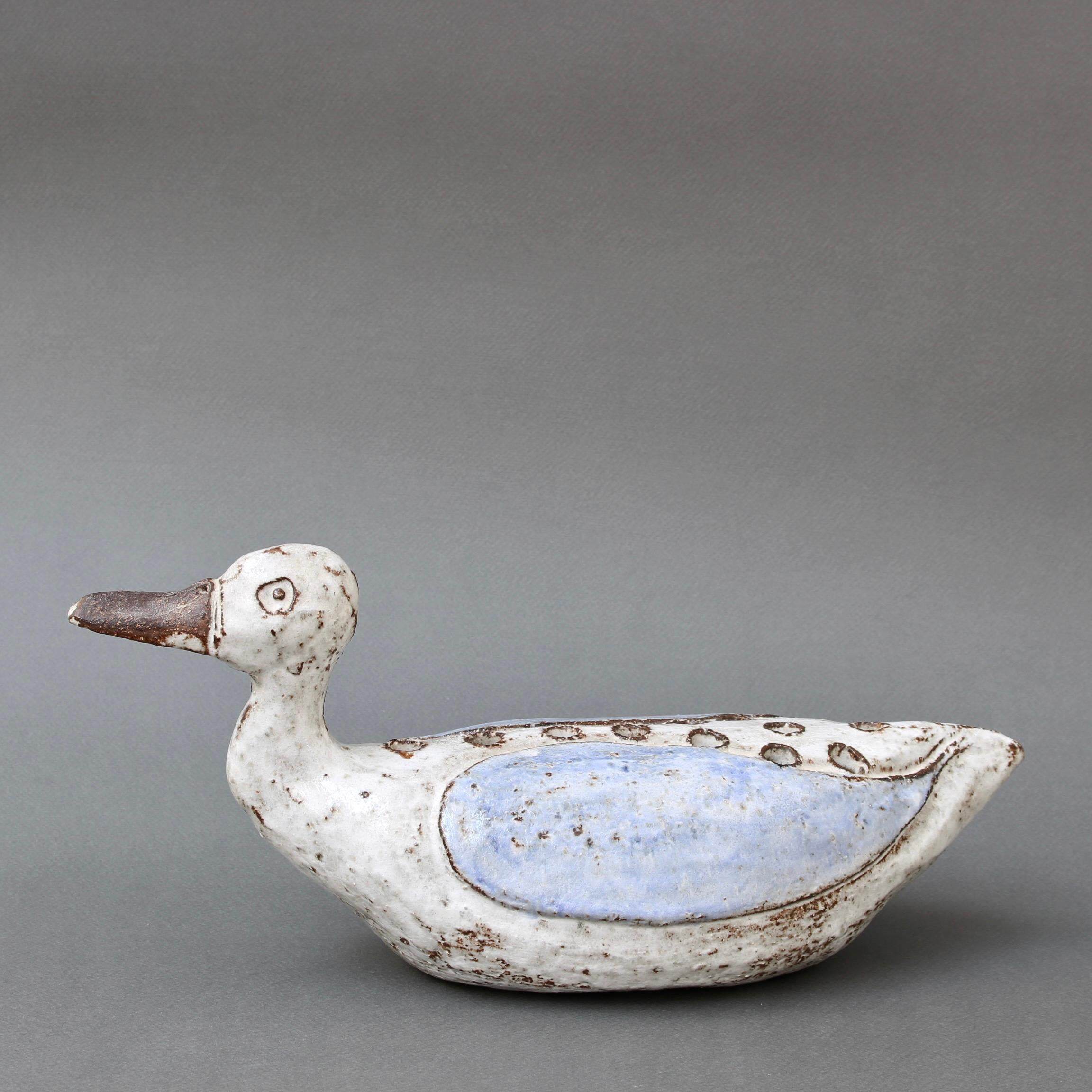 Mid-century French ceramic duck flower vase (circa 1960s) by Albert Thiry. A chalk-white glaze is complemented by a delicate, pale blue on the wings of this ceramic duck-shaped vase. The markings and colouring are quintessential Albert Thiry with